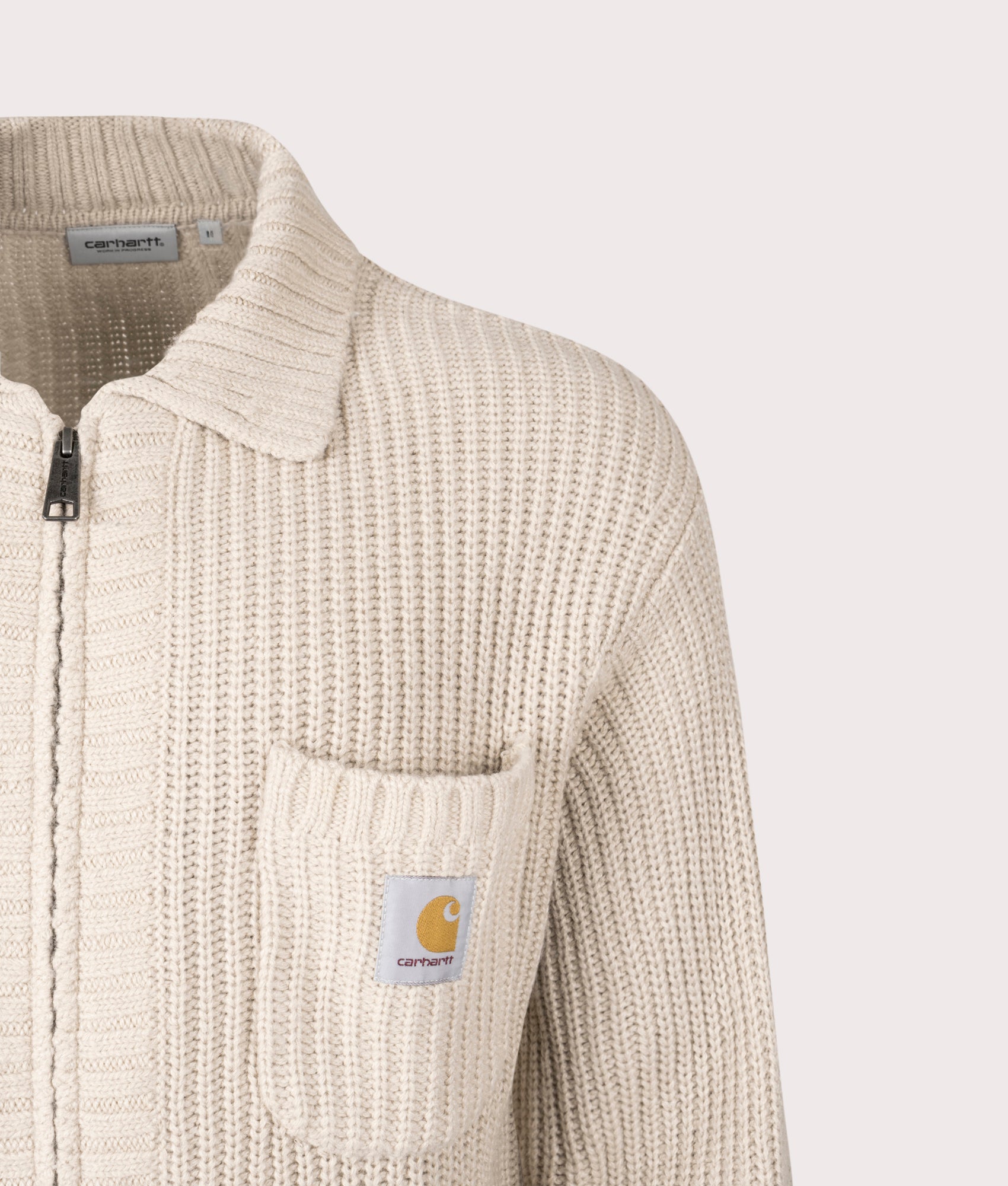 Carhartt WIP Chore Knit Jacket in Fleur De Sel at EQVVS Menswear. Detail shot.