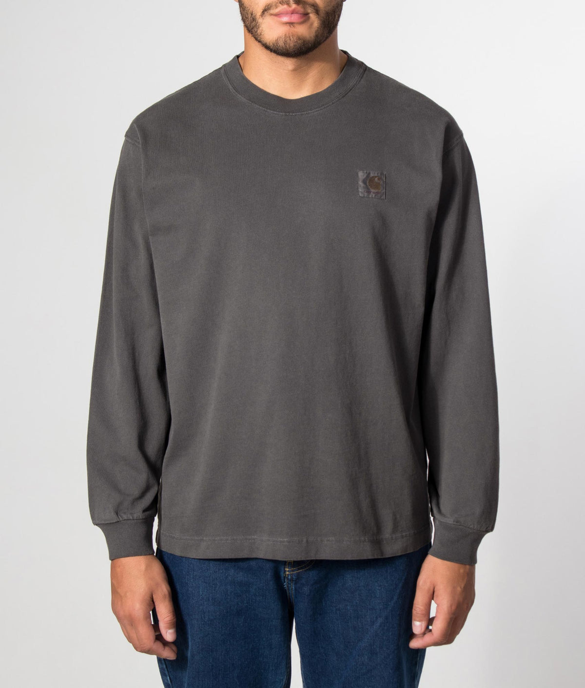 Carhartt WIP Loose Fit Vista Long Sleeve T-Shirt in Black at EQVVS Menswear. Model front shot.