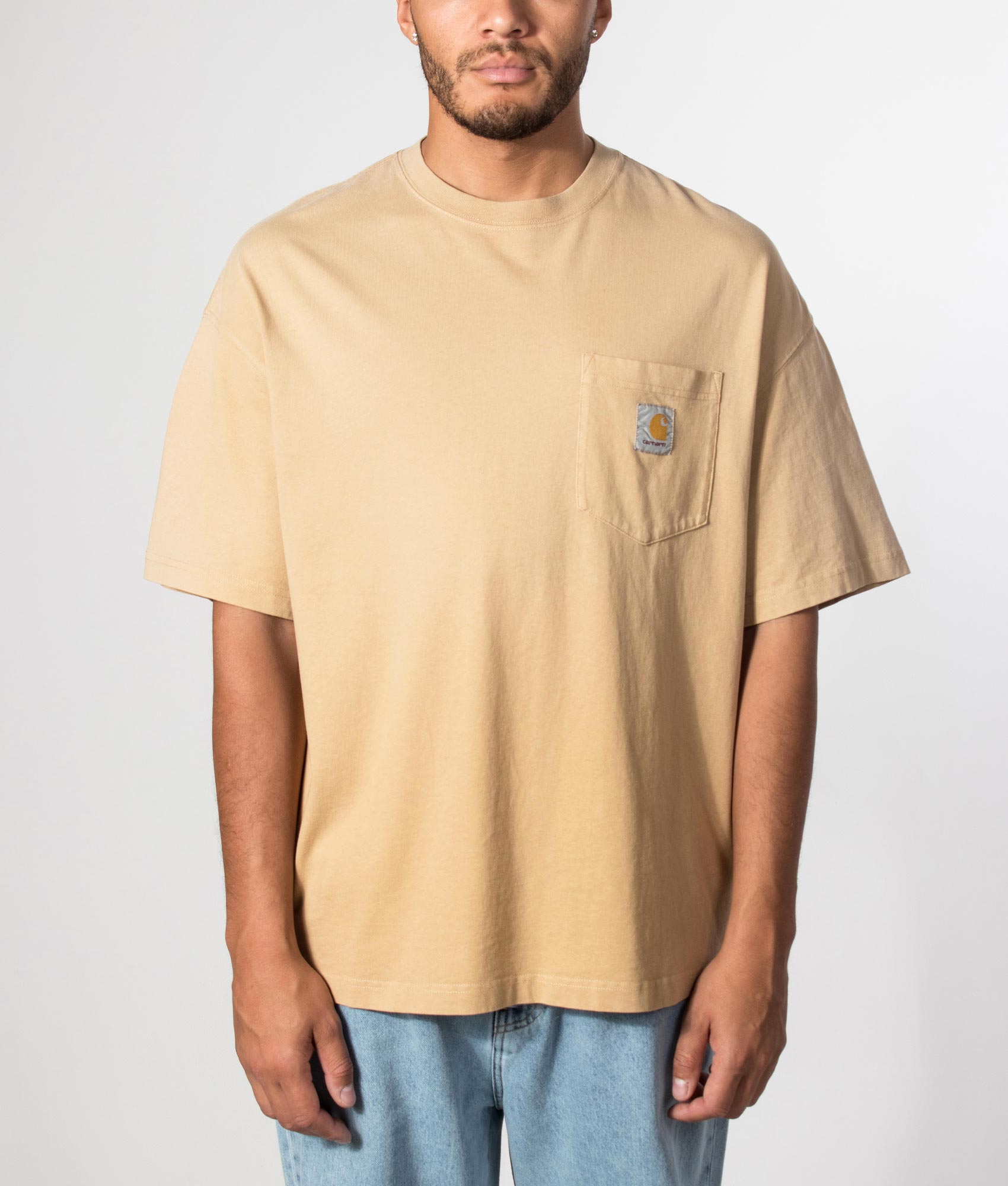 Carhartt WIP Boxy Loose Fit Hudson Pocket T-Shirt in Dusty H Brown at EQVVS Menswear. Model front shot.