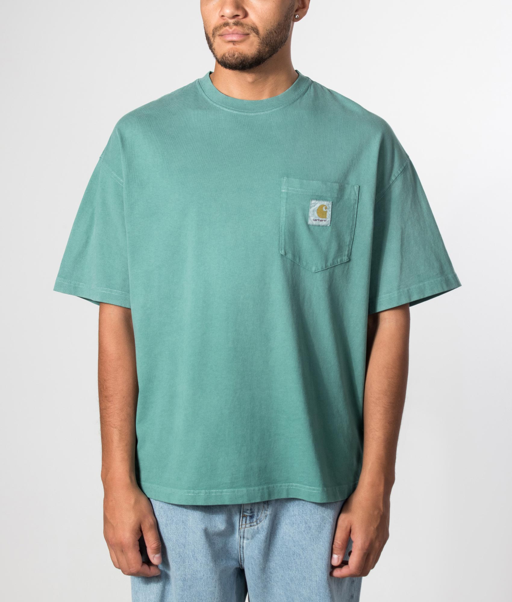 Carhartt WIP Boxy Loose Fit Hudson Pocket T-Shirt in Saguaro at EQVVS Menswear. Model front shot.