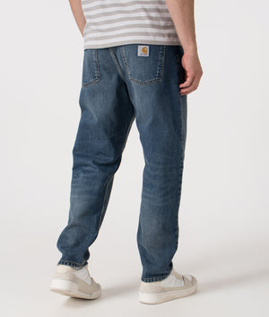 Relaxed Fit Newel Jeans in 014L Blue. 100% Cotton | Carhartt WIP | Shot at EQVVS | Back angle  shot 