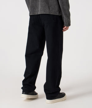 Relaxed Fit Aaron Pants in 01LF  Blue. 100% Cotton  | Carhartt WIP | Shot at EQVVS | Back angle shot 