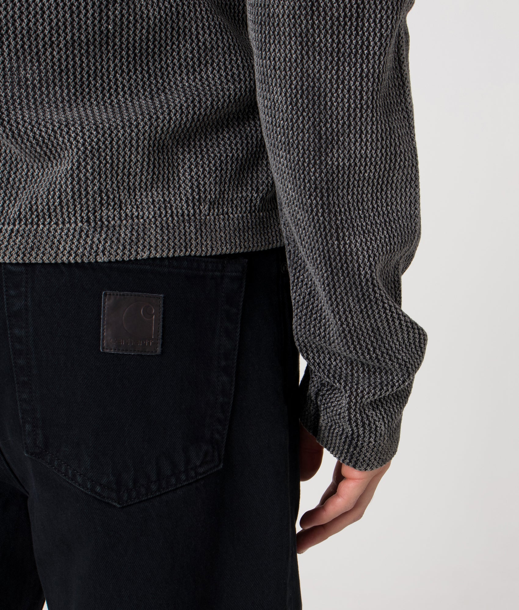 Carhartt WIP Relaxed Fit Aaron Pants in 01LF Blue at EQVVS Menswear. Model detail shot.