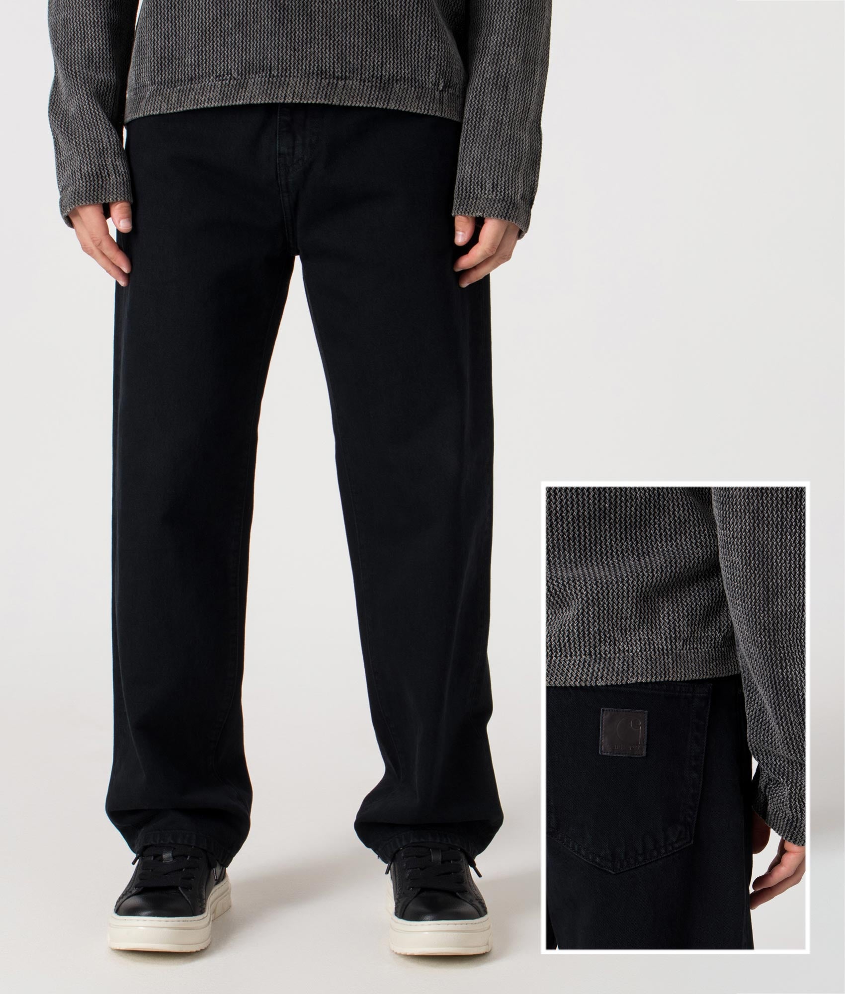 Carhartt WIP Relaxed Fit Aaron Pants in 01LF Blue at EQVVS Menswear. Model front and detail shot. 