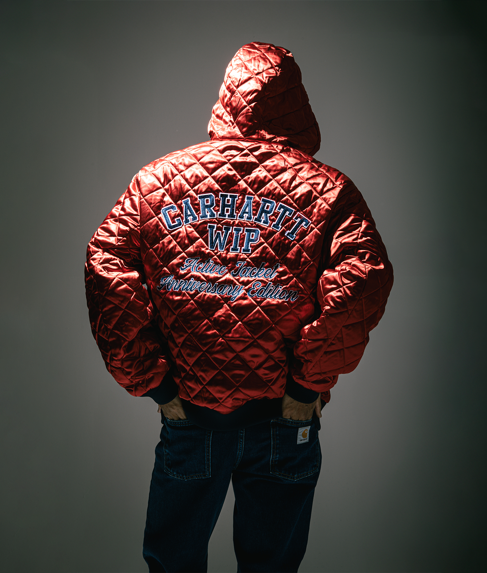 Carhartt WIP 50 Years Anniversary OG Active Denim Reversible Jacket in Blue/USA Red at EQVVS Menswear. Side B campaign shot.