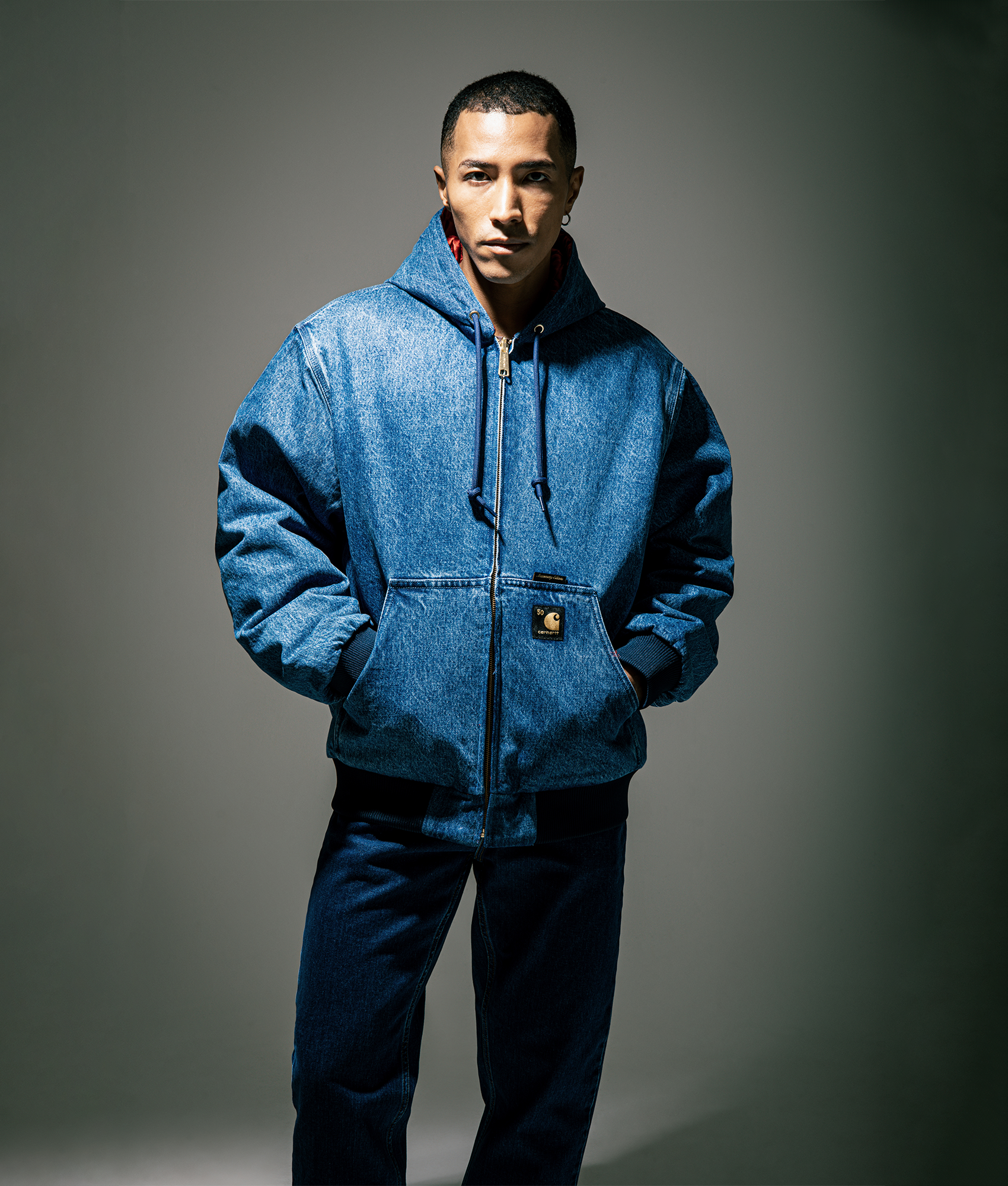 Carhartt WIP 50 Years Anniversary OG Active Denim Reversible Jacket in Blue/USA Red at EQVVS Menswear. Side A campaign shot.