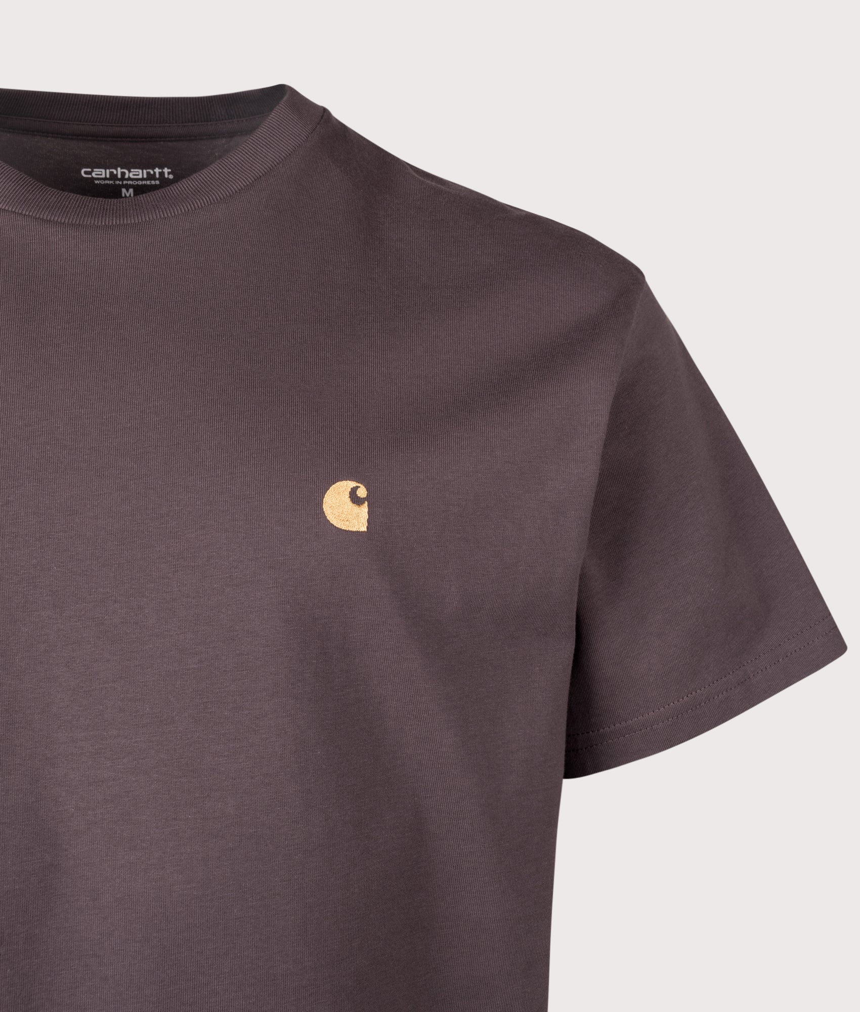 Carhartt WIP Relaxed Fit Chase T-Shirt in Shale and Gold at EQVVS Menswear. Detail shot.