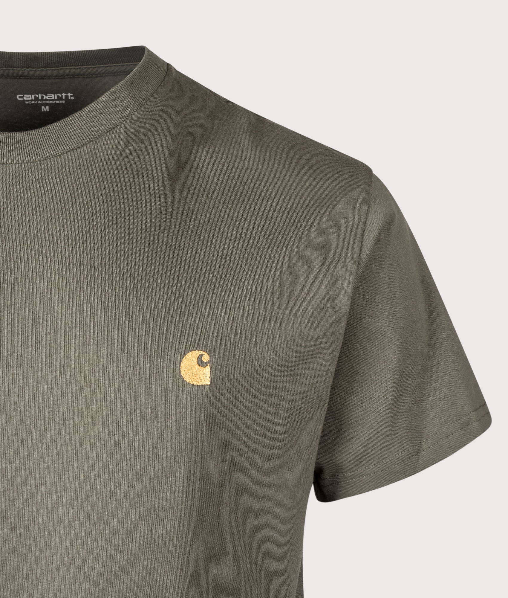 Carhartt WIP Relaxed Fit Chase T-Shirt in Leaf and Gold at EQVVS Menswear. Detail shot.