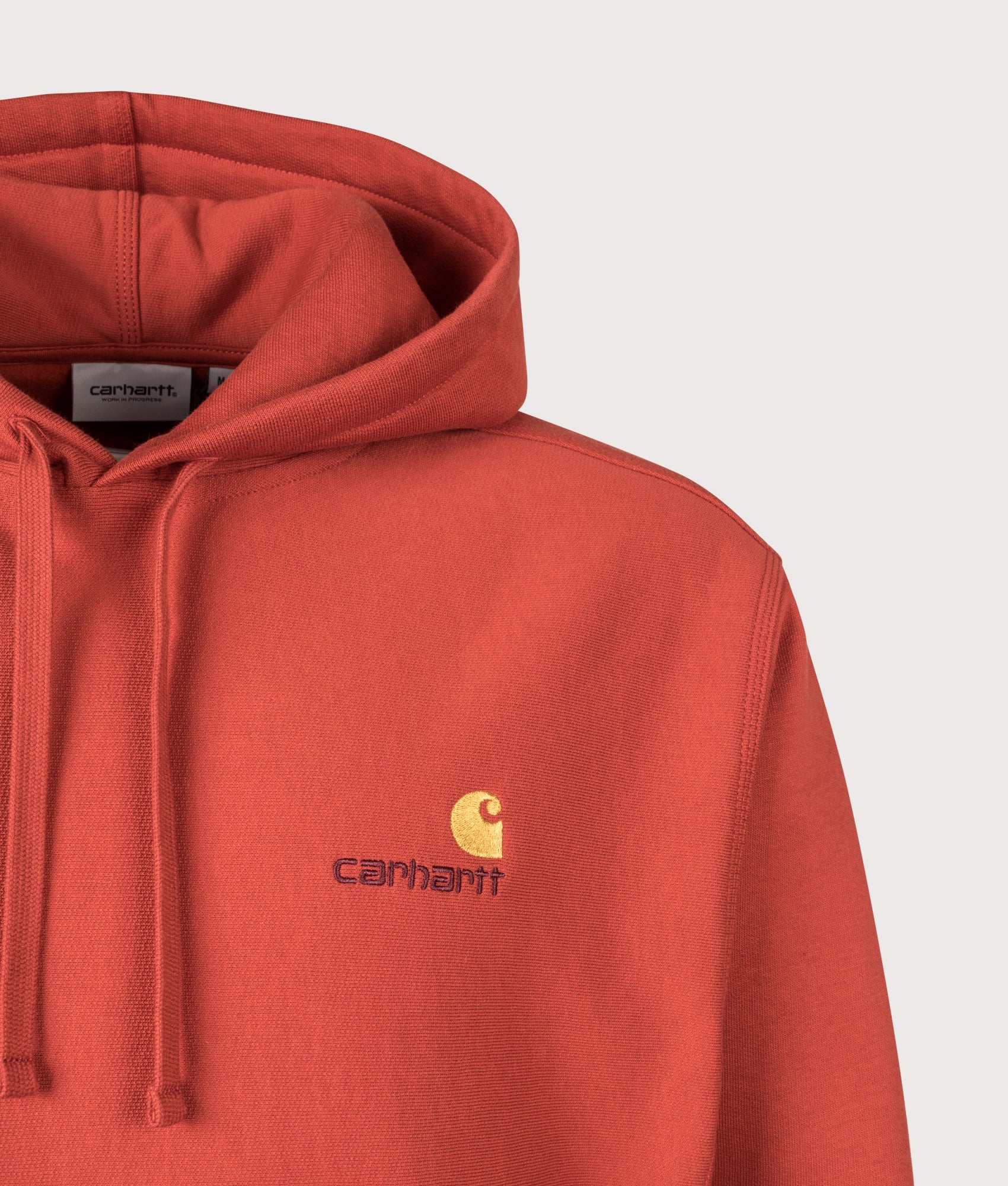 Carhartt WIP Boxy Loose Fit American Script Hoodie in Oxide Red at EQVVS Menswear. Detail shot.