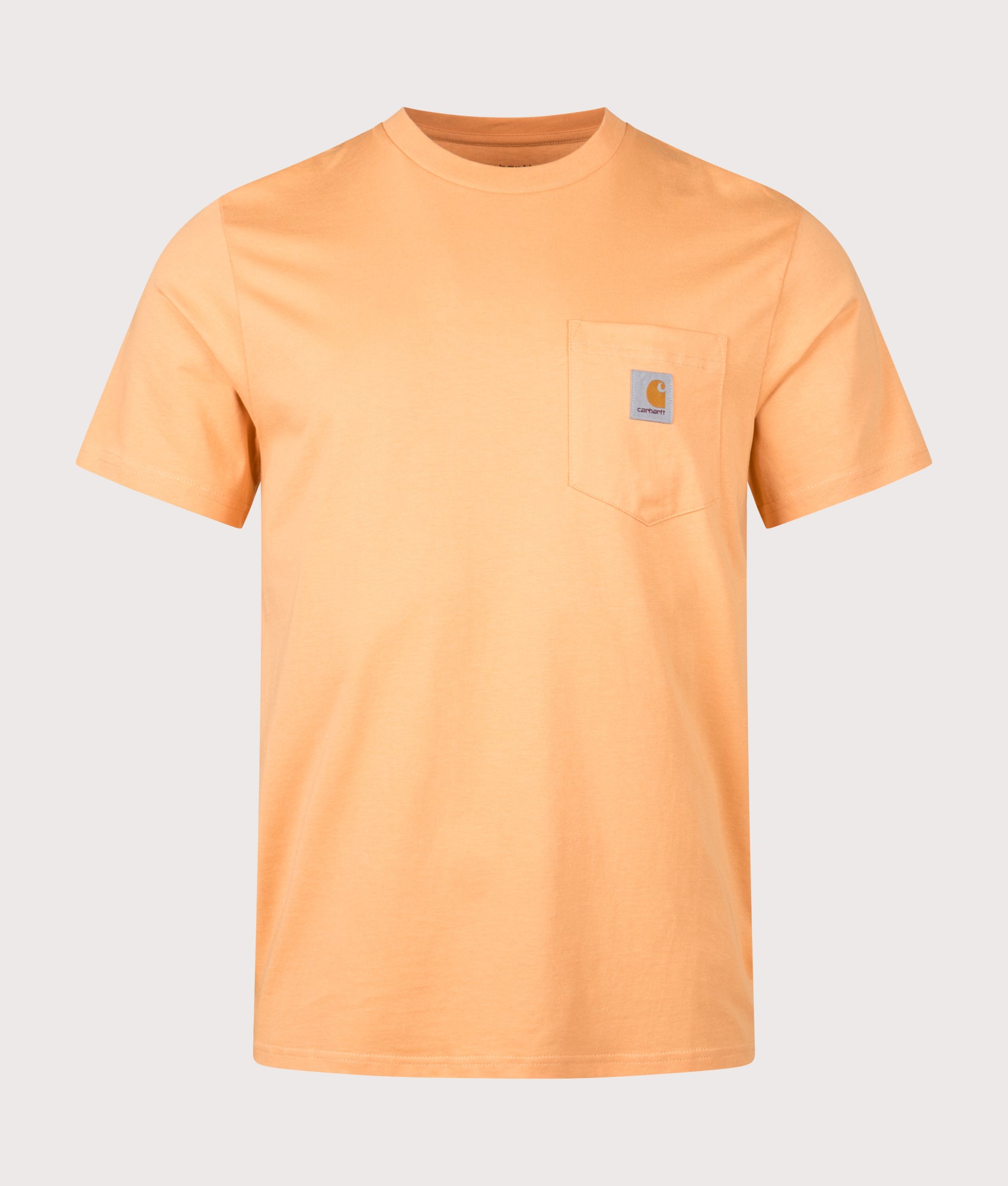 Carhartt WIP Pocket T-Shirt in Gentle Orange at EQVVS Menswear. Front shot.