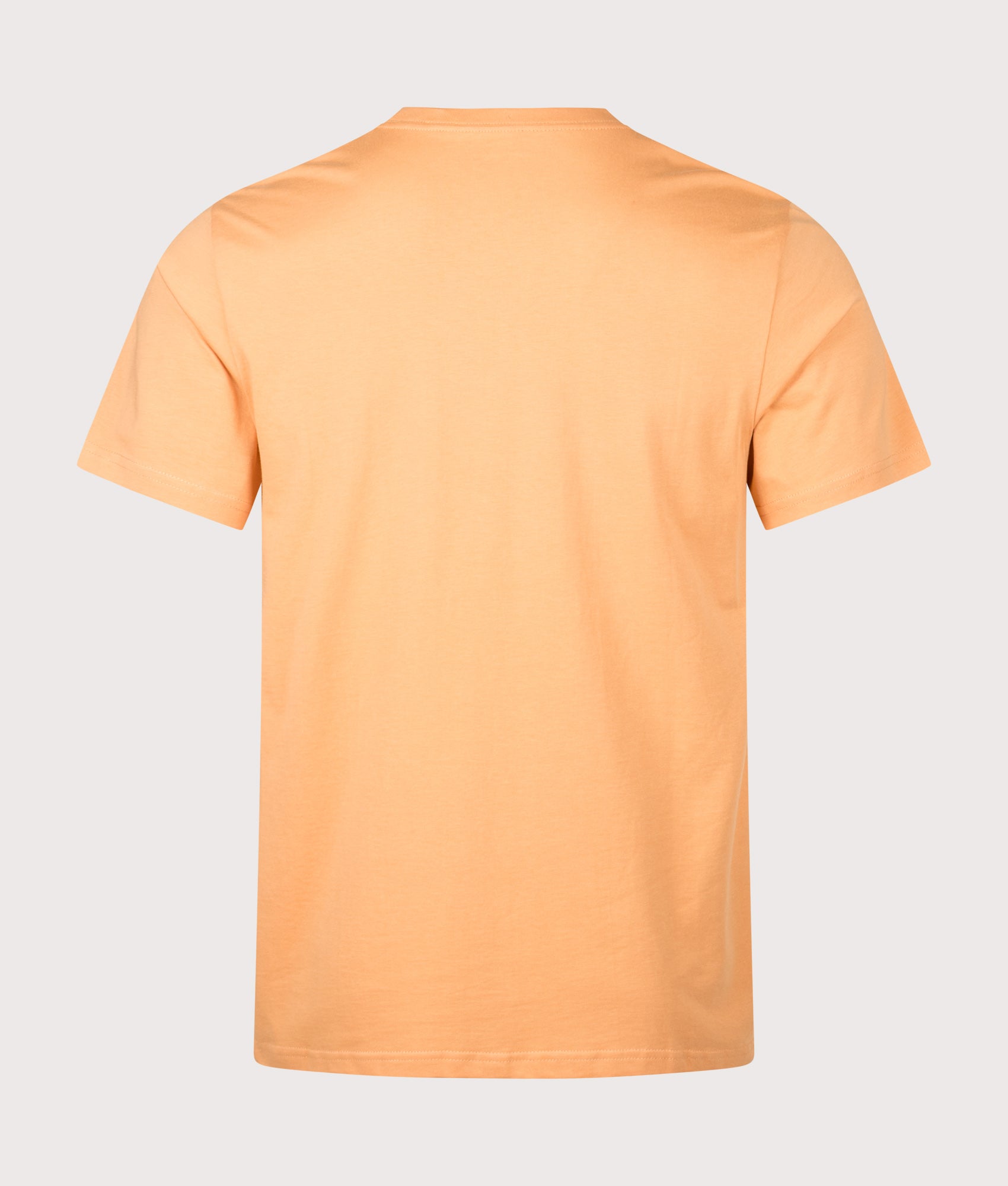Carhartt WIP Pocket T-Shirt in Gentle Orange at EQVVS Menswear. Back shot.