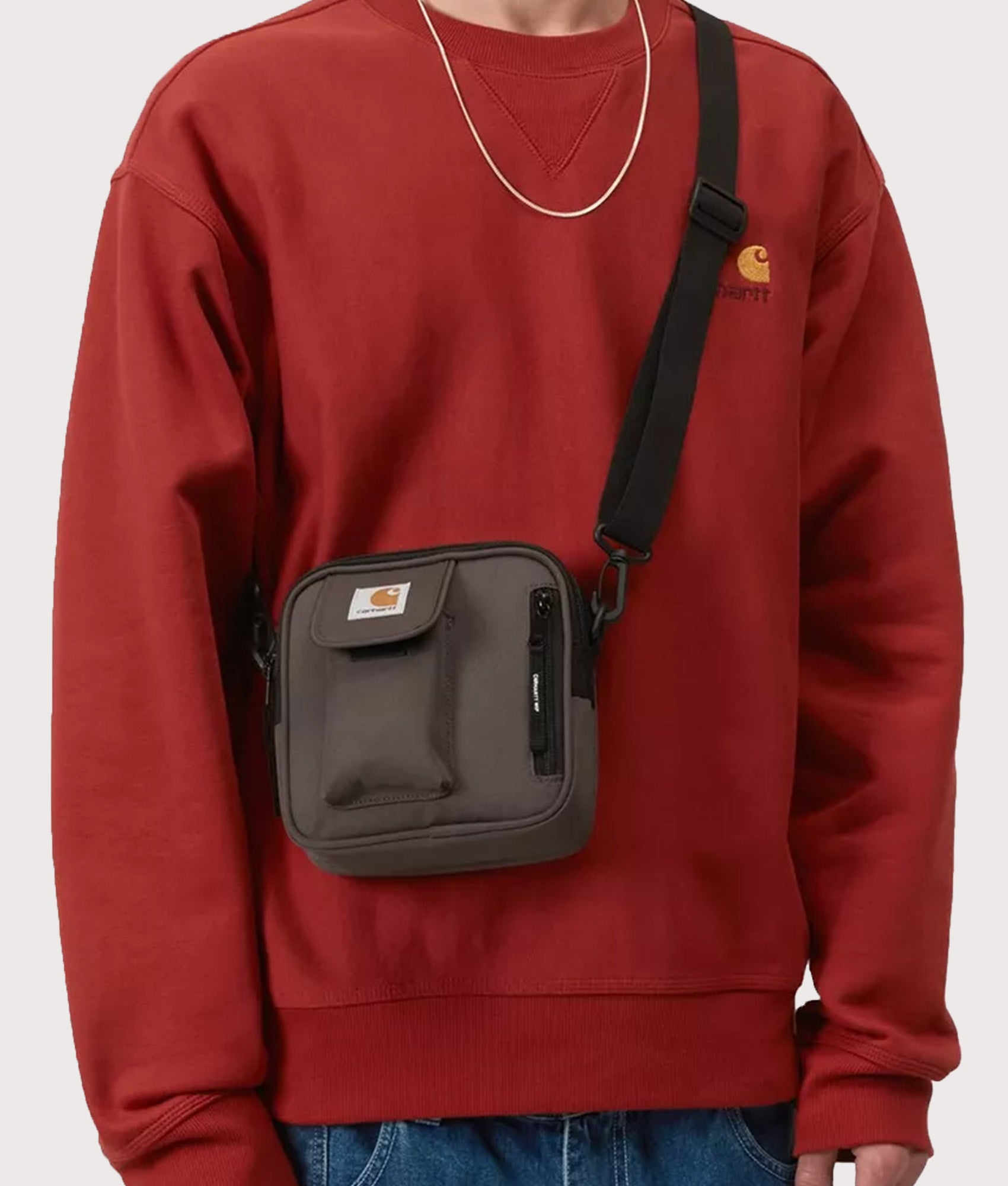 Carhartt WIP Essentials Bag in Shale at EQVVS Menswear. Model front shot.