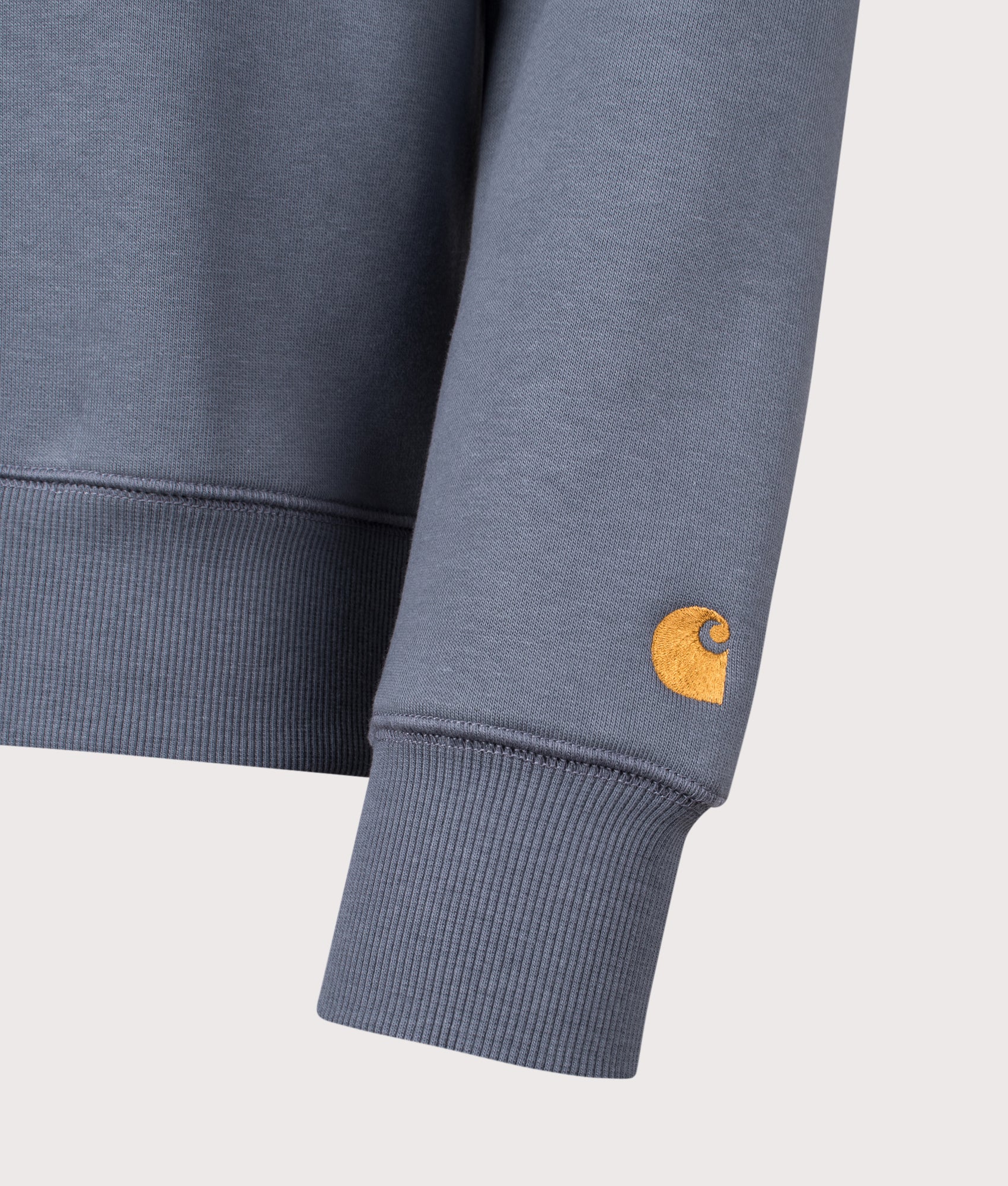 Carhartt WIP Chase Sweatshirt in Cozy Blue and Gold at EQVVS Menswear. Detail shot.
