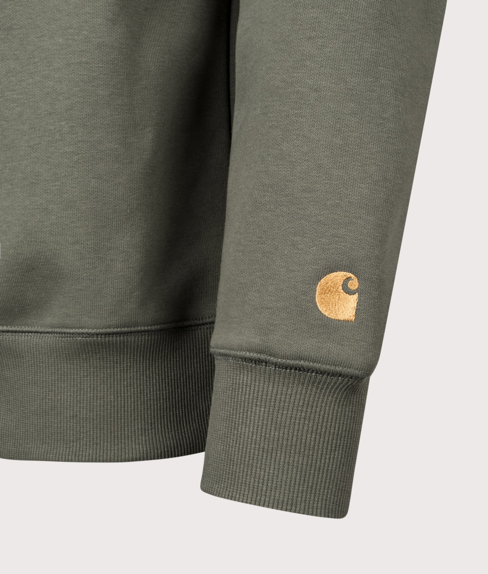 Carhartt WIP Chase Sweatshirt in Leaf and Gold at EQVVS Menswear. Detail shot.