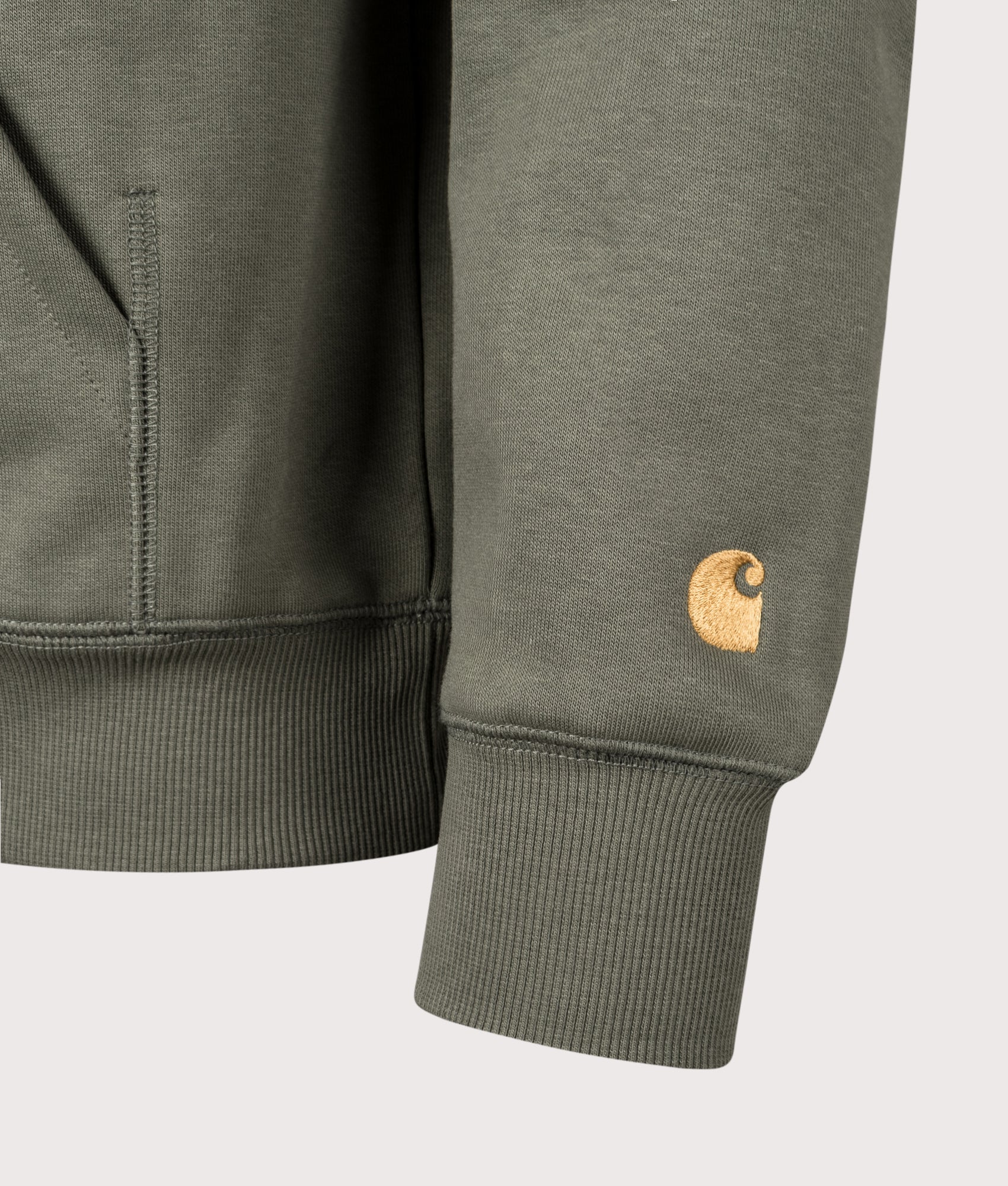 Carhartt WIP Chase Hoodie in Leaf and Gold at EQVVS Menswear. Detail shot.
