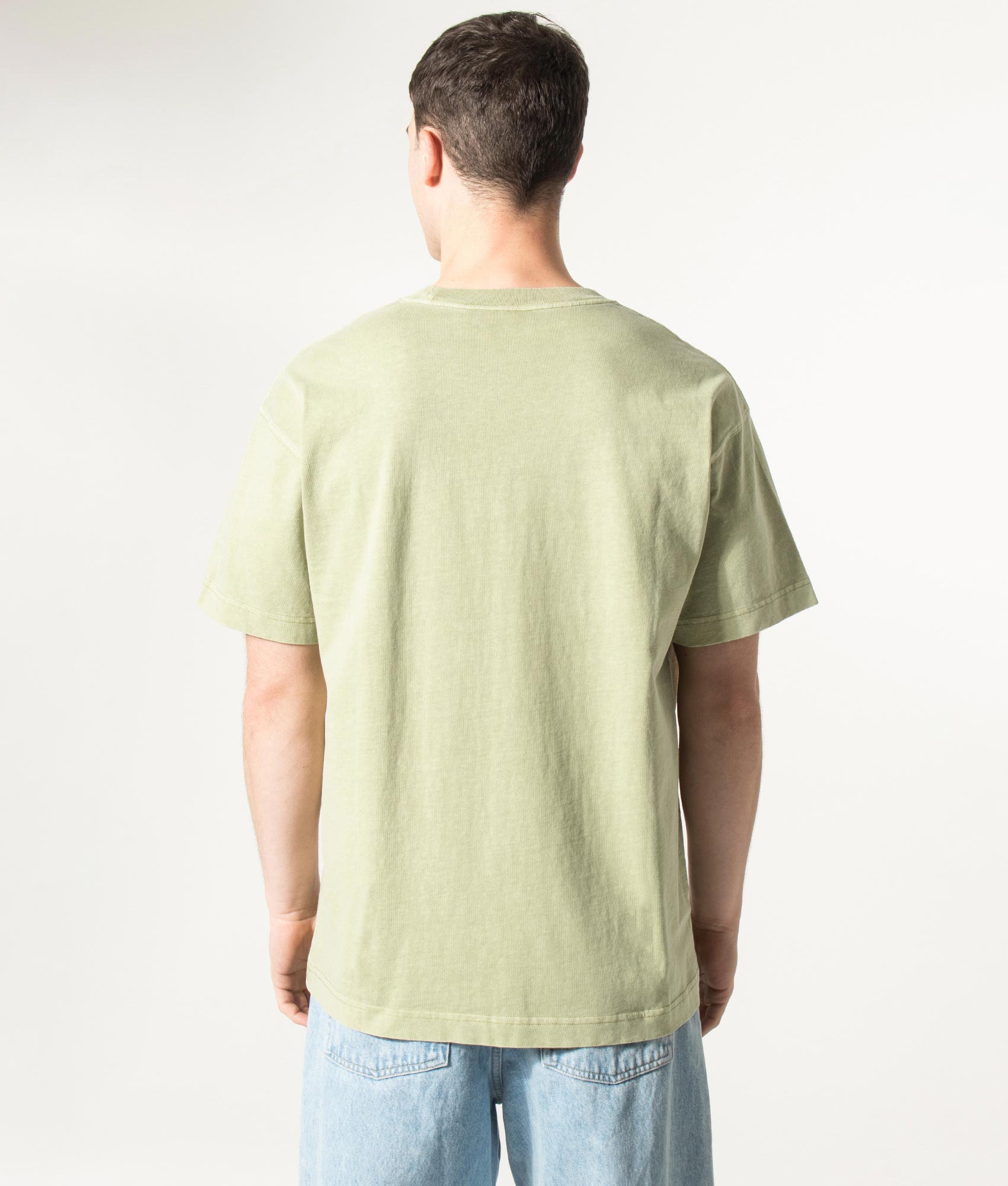 Carhartt WIP Relaxed Fit Nelson T-Shirt in Gentle Green at EQVVS Menswear. Model back shot.