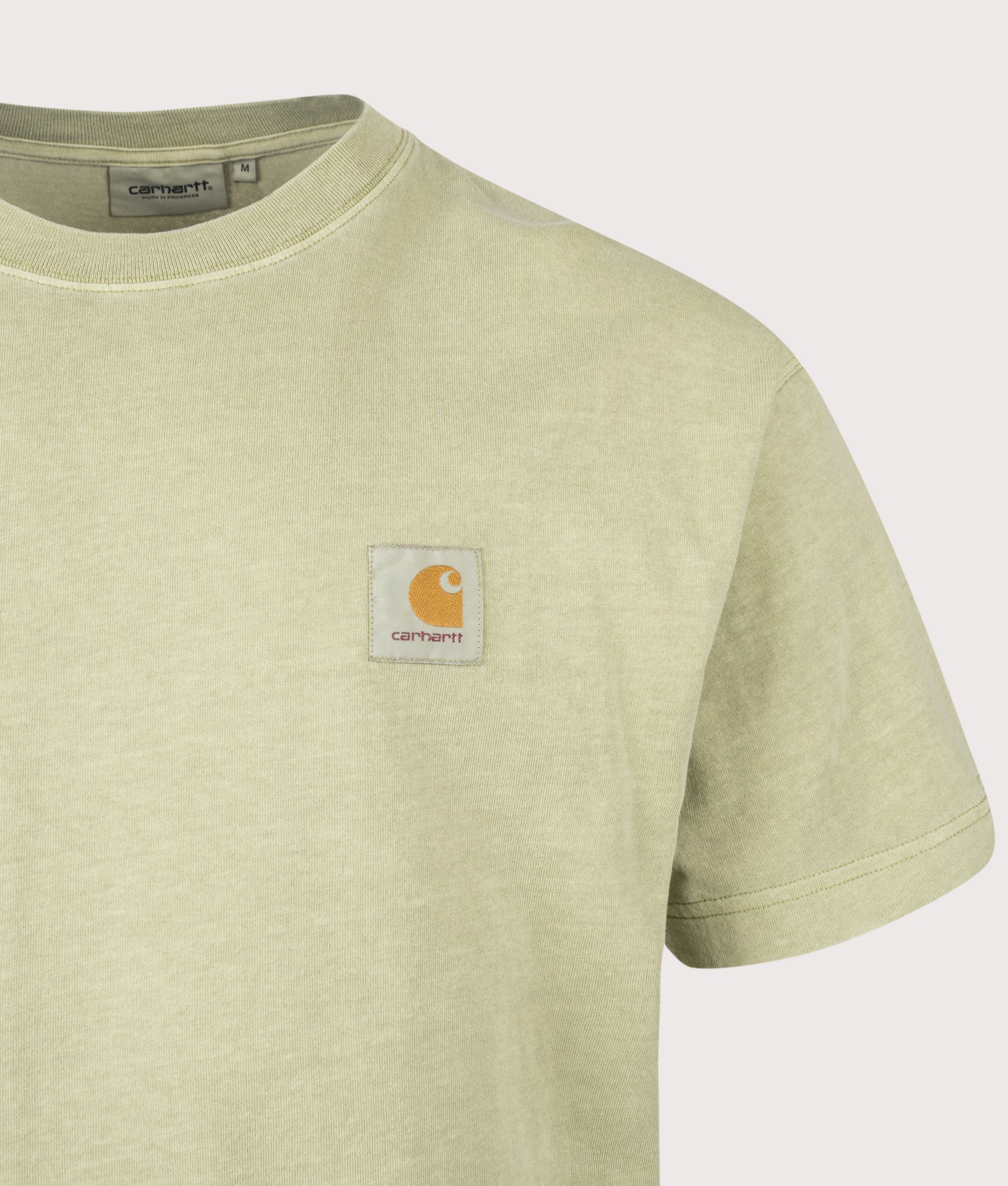 Carhartt WIP Relaxed Fit Nelson T-Shirt in Gentle Green at EQVVS Menswear. Detail shot.