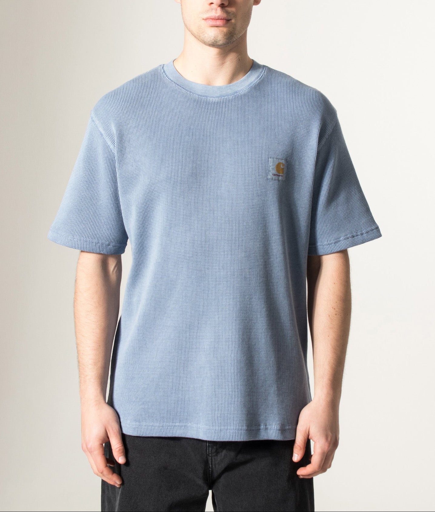 Carhartt WIP Relaxed Fit Nelson Waffle T-Shirt in Gentle Blue at EQVVS Menswear. Model front shot.
