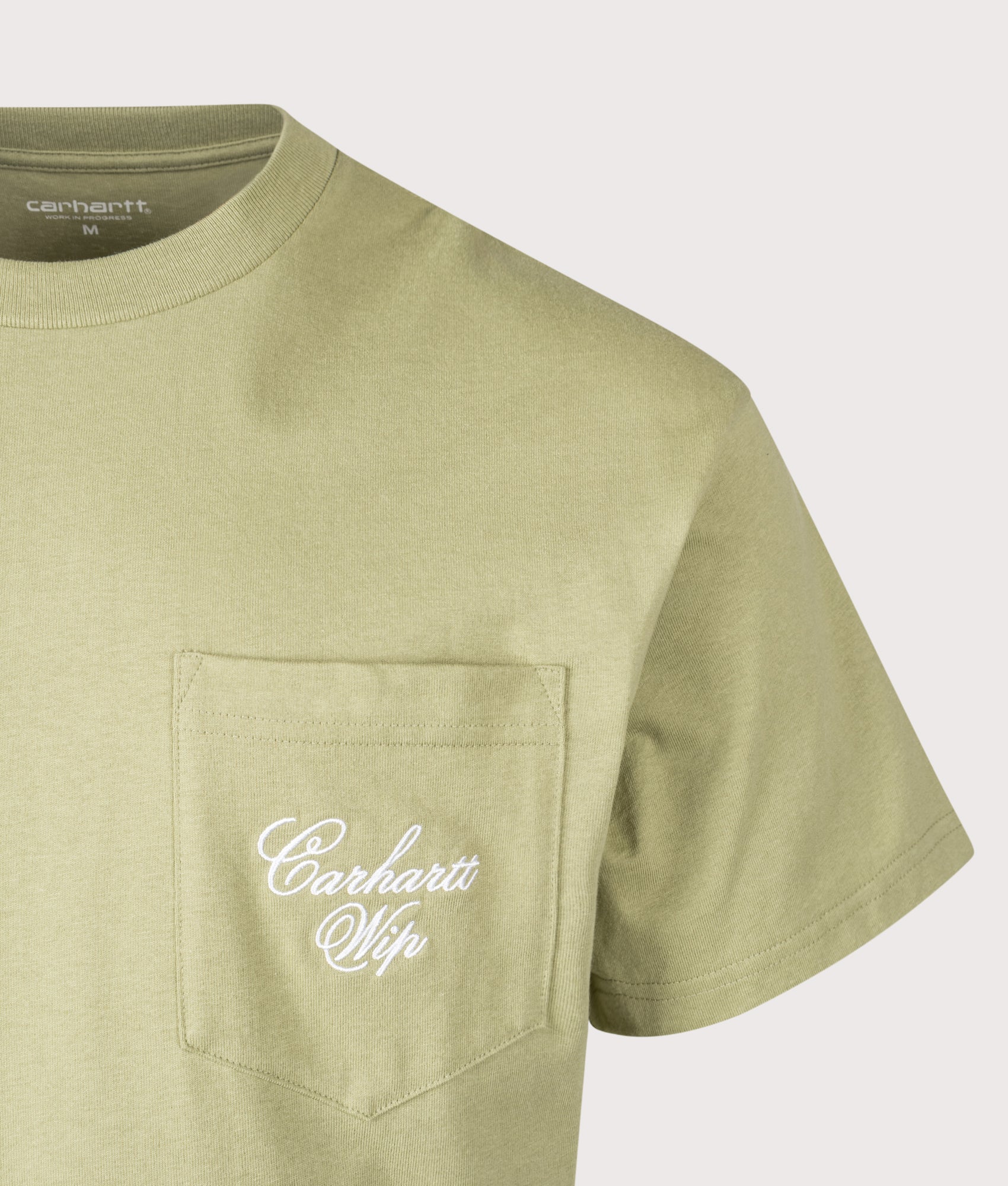 Carhartt WIP Loose Fit Longhand Pocket T-Shirt in Gentle Green at EQVVS Menswear. Detail shot.