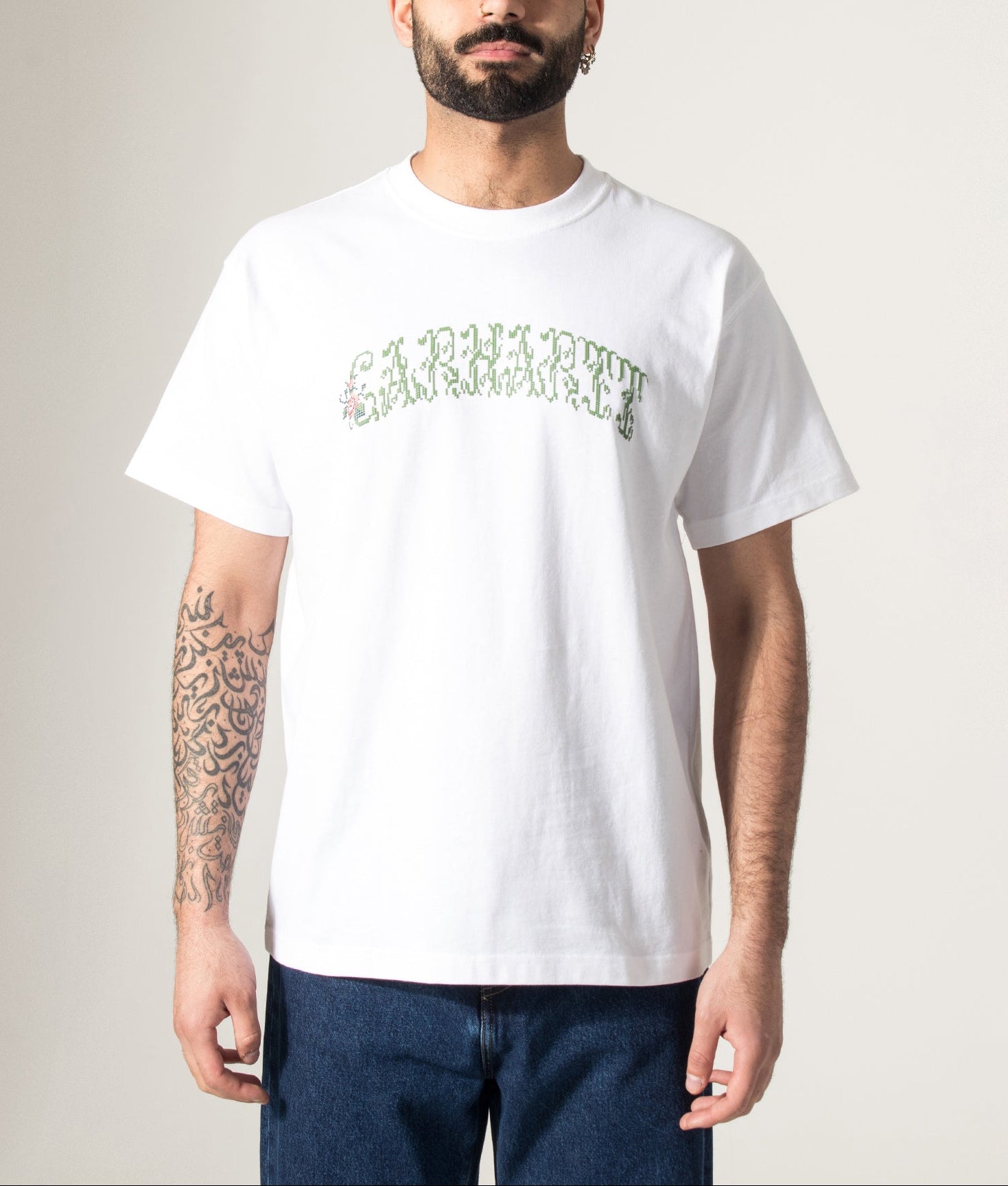 Carhartt WIP Relaxed Fit Monogram T-Shirt in White at EQVVS Menswear. Model front shot.