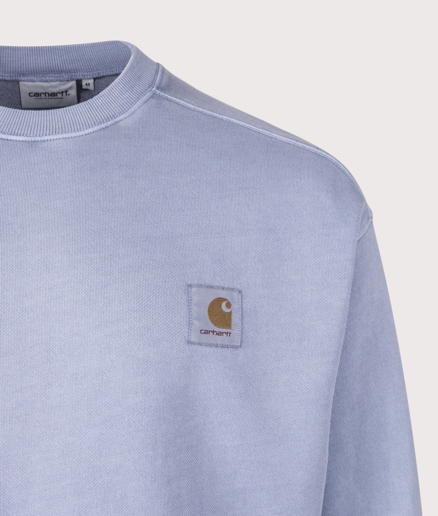 Carhartt WIP Oversized Nelson Sweatshirt in Gentle Blue at EQVVS Menswear. Detail shot.