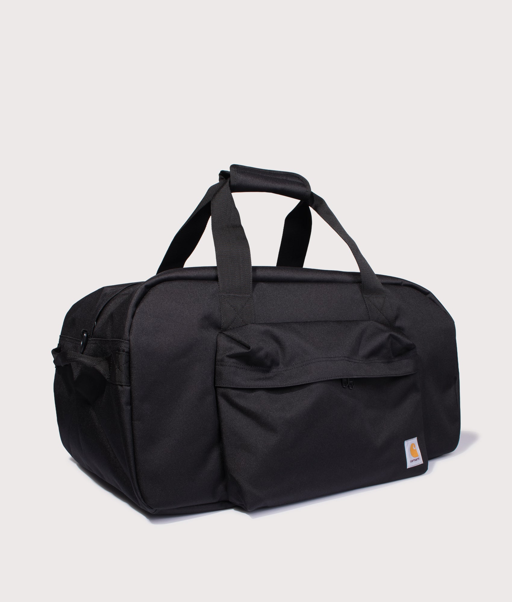 Carhartt WIP Duffle Bag in Black at EQVVS Menswear. Angled front shot.