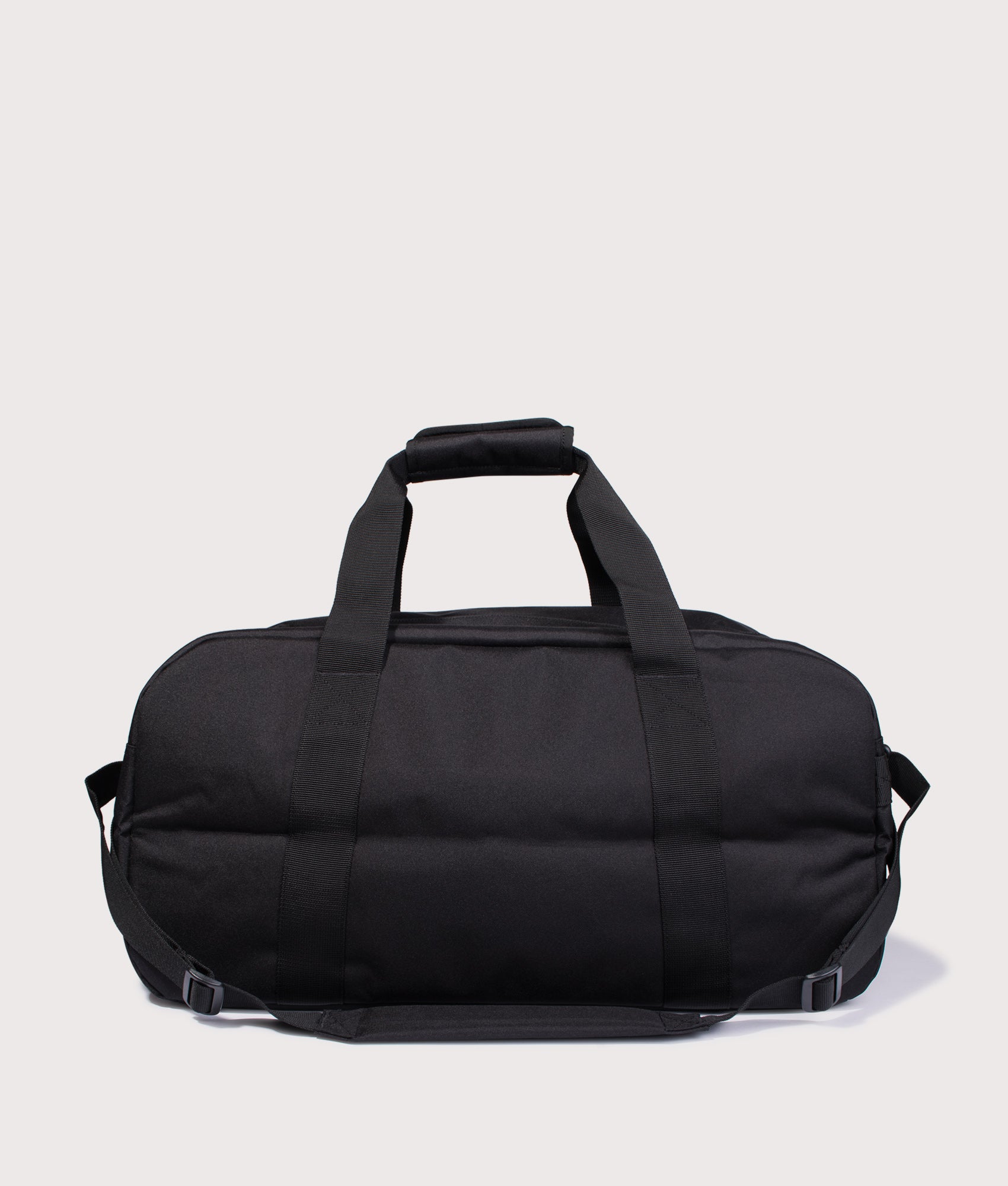 Carhartt WIP Duffle Bag in Black at EQVVS Menswear. Back shot.
