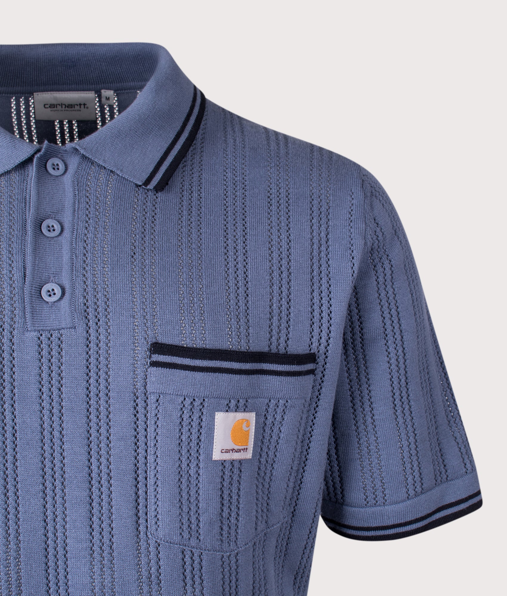 Carhartt WIP Ramsey Polo Shirt in Velvet Blue and Deep Night at EQVVS Menswear. Detail shot.