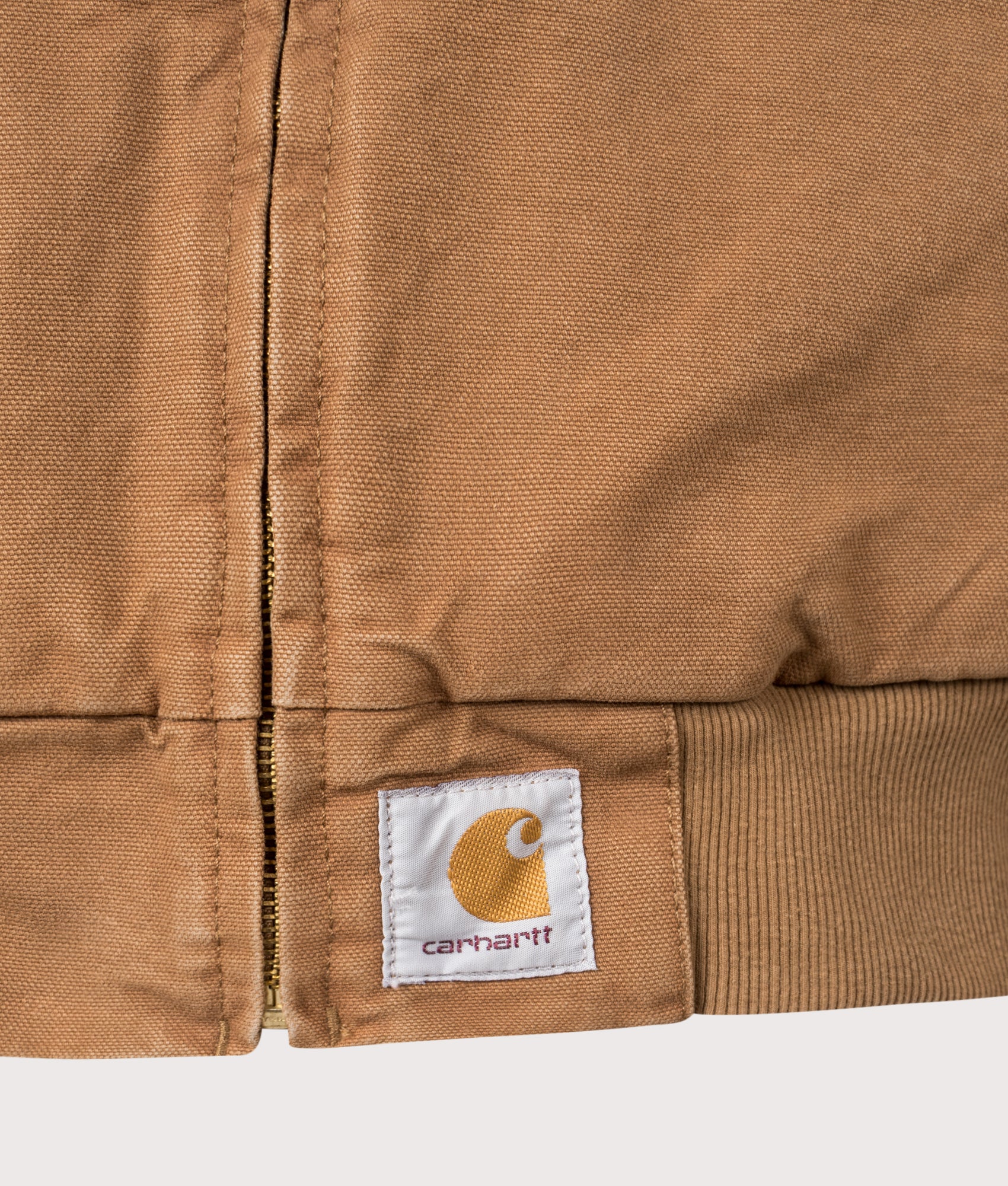 Carhartt WIP OG Santa Fe Jacket in Hamilton Brown and Tobacco at EQVVS Menswear. Detail shot. 