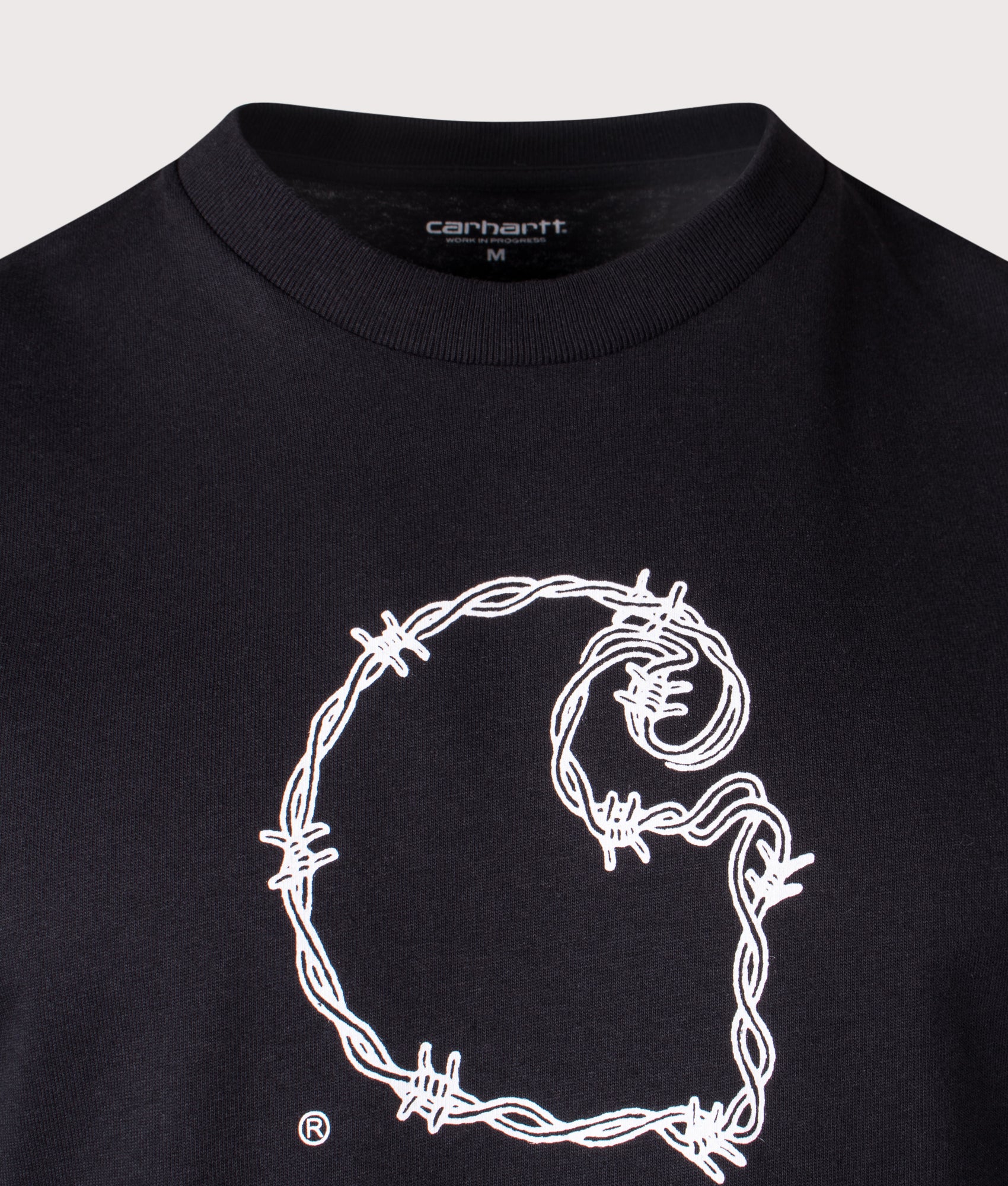 Carhartt WIP Loose Fit Barbwire C T-Shirt in Black at EQVVS Menswear. Detail shot.
