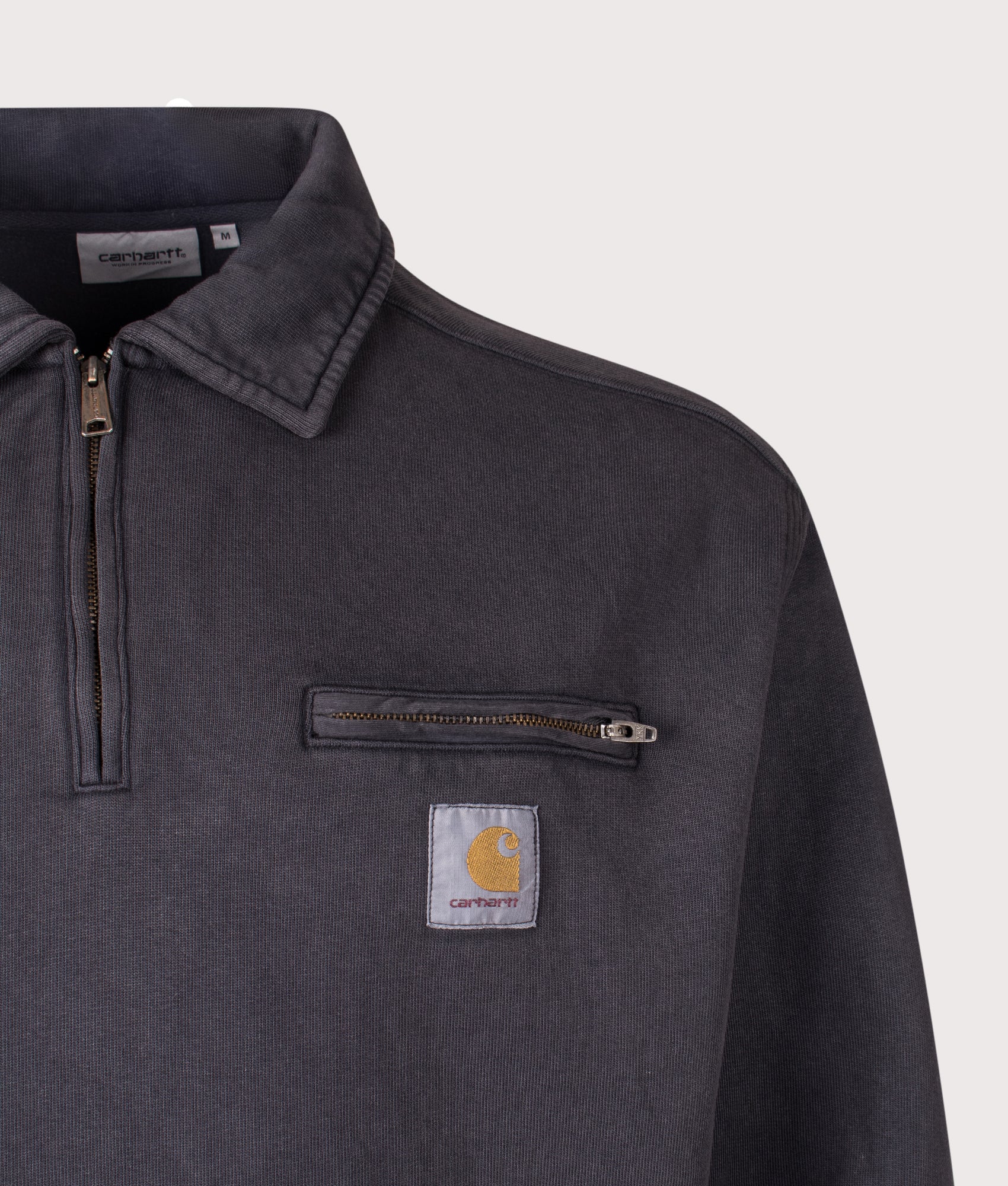 Carhartt WIP Oversized Half Zip Detroit Sweatshirt in Black at EQVVS Menswear. Detail shot.