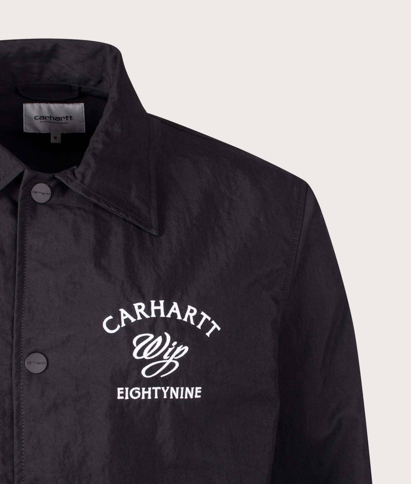 Eightynine Coach Jacket in Black/White by Carhartt WIP. Shot by EQVVS. Detail shot.