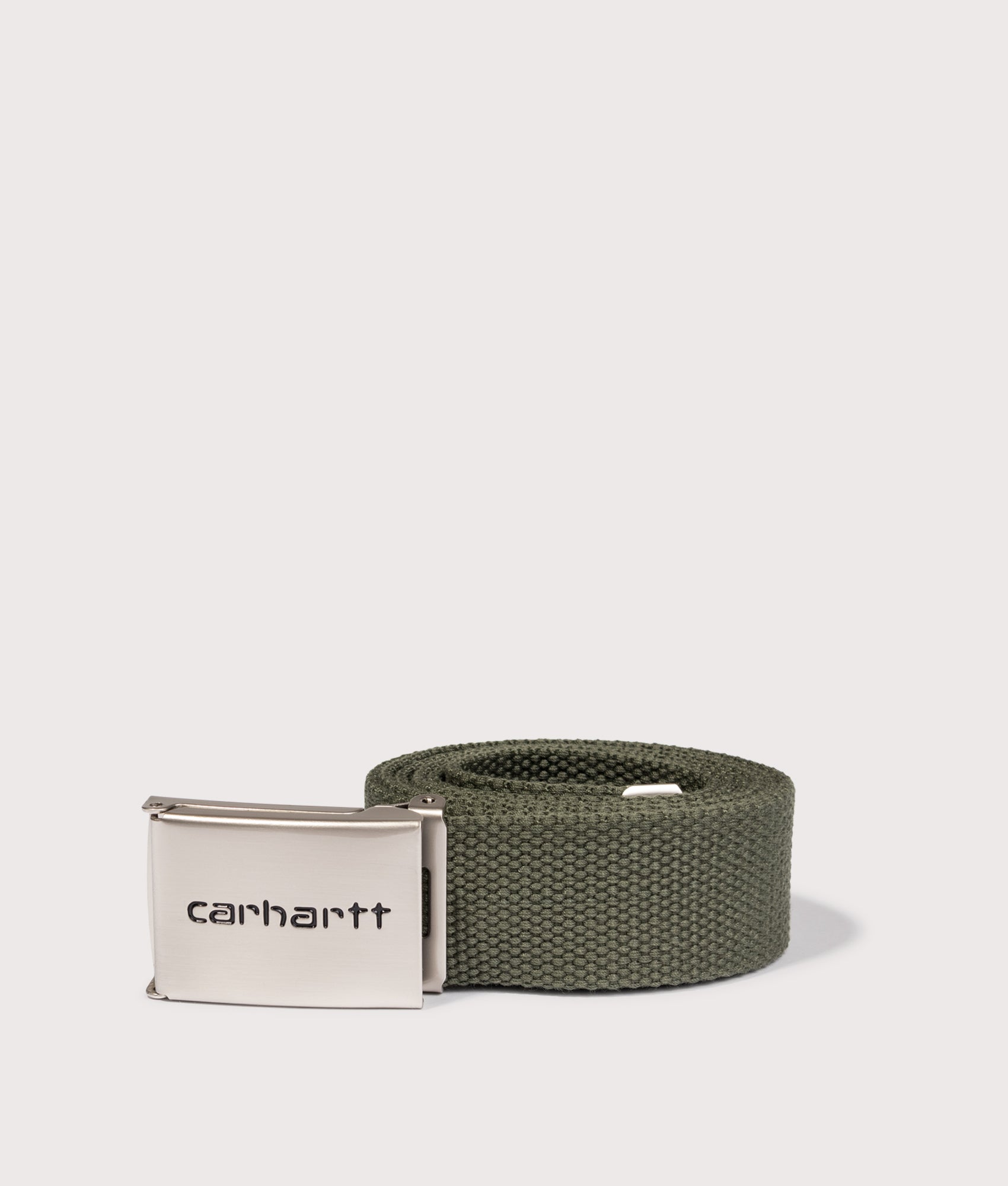 Carhartt WIP Chrome Logo Clip Belt in Leaf at EQVVS Menswear. Rolled shot.