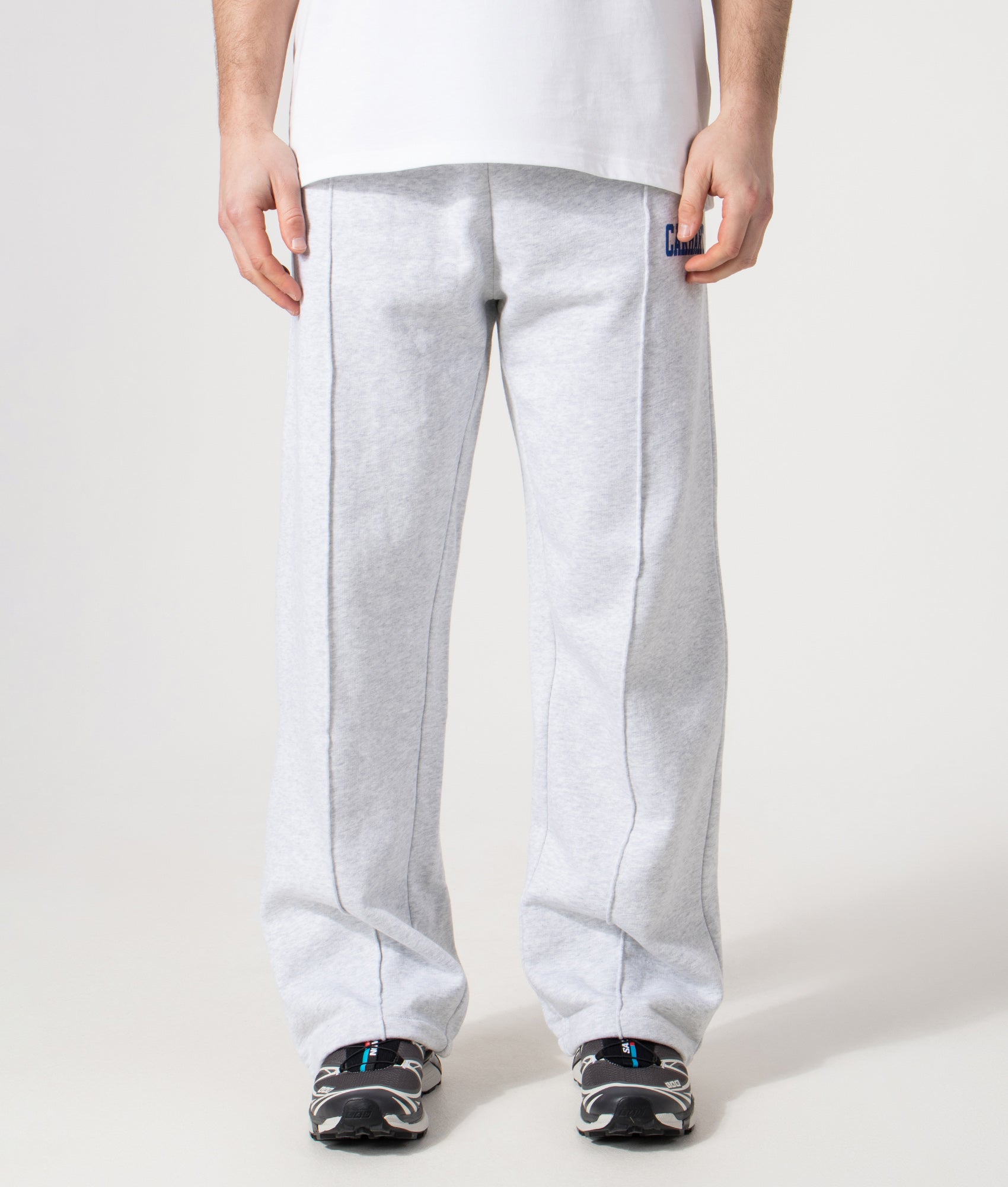 Carhartt WIP Relaxed Fit Pond Corps Sweatpants in Ash Heather at EQVVS Menswear. Model front shot.