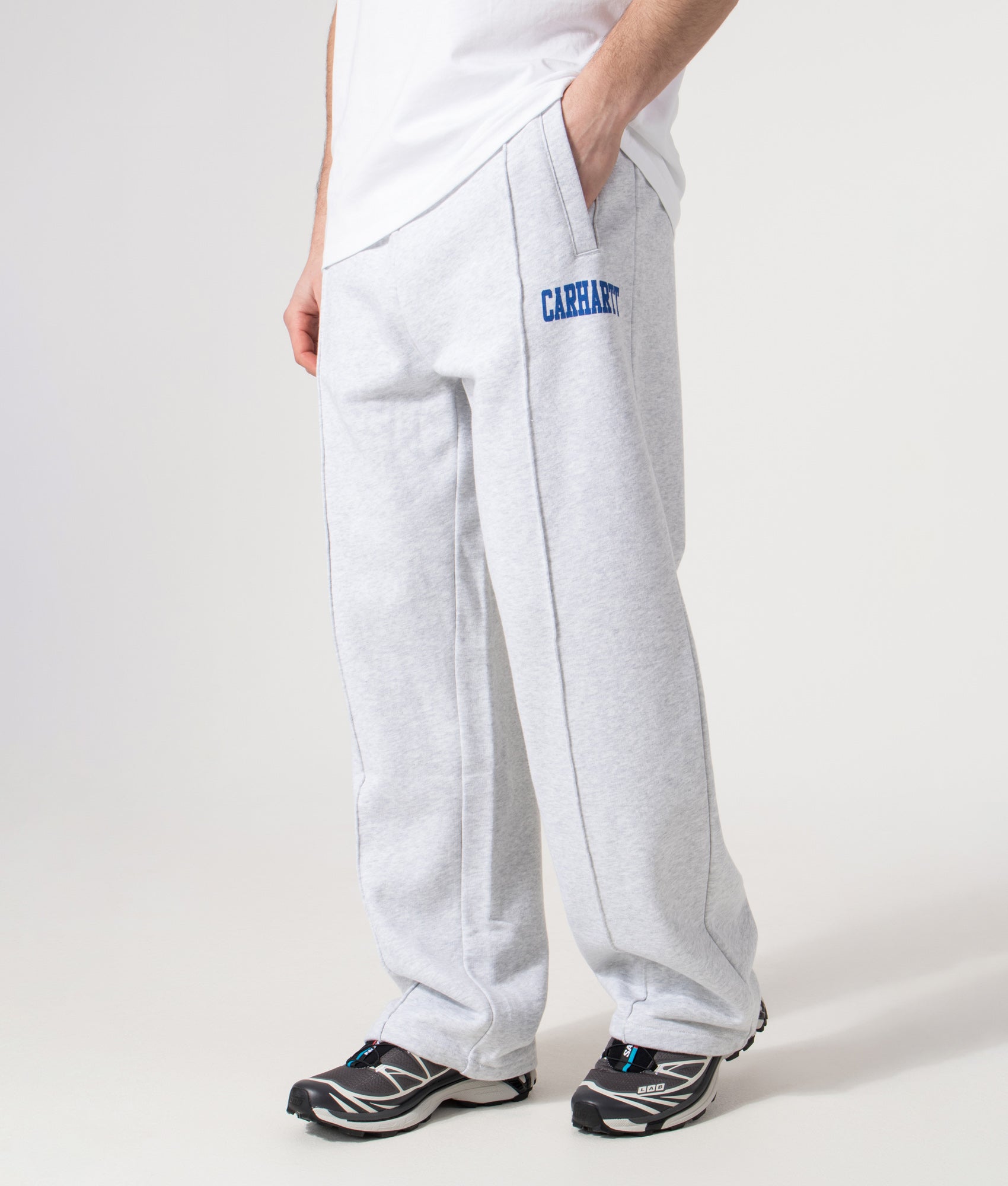 Carhartt WIP Relaxed Fit Pond Corps Sweatpants in Ash Heather at EQVVS Menswear. Model front shot.