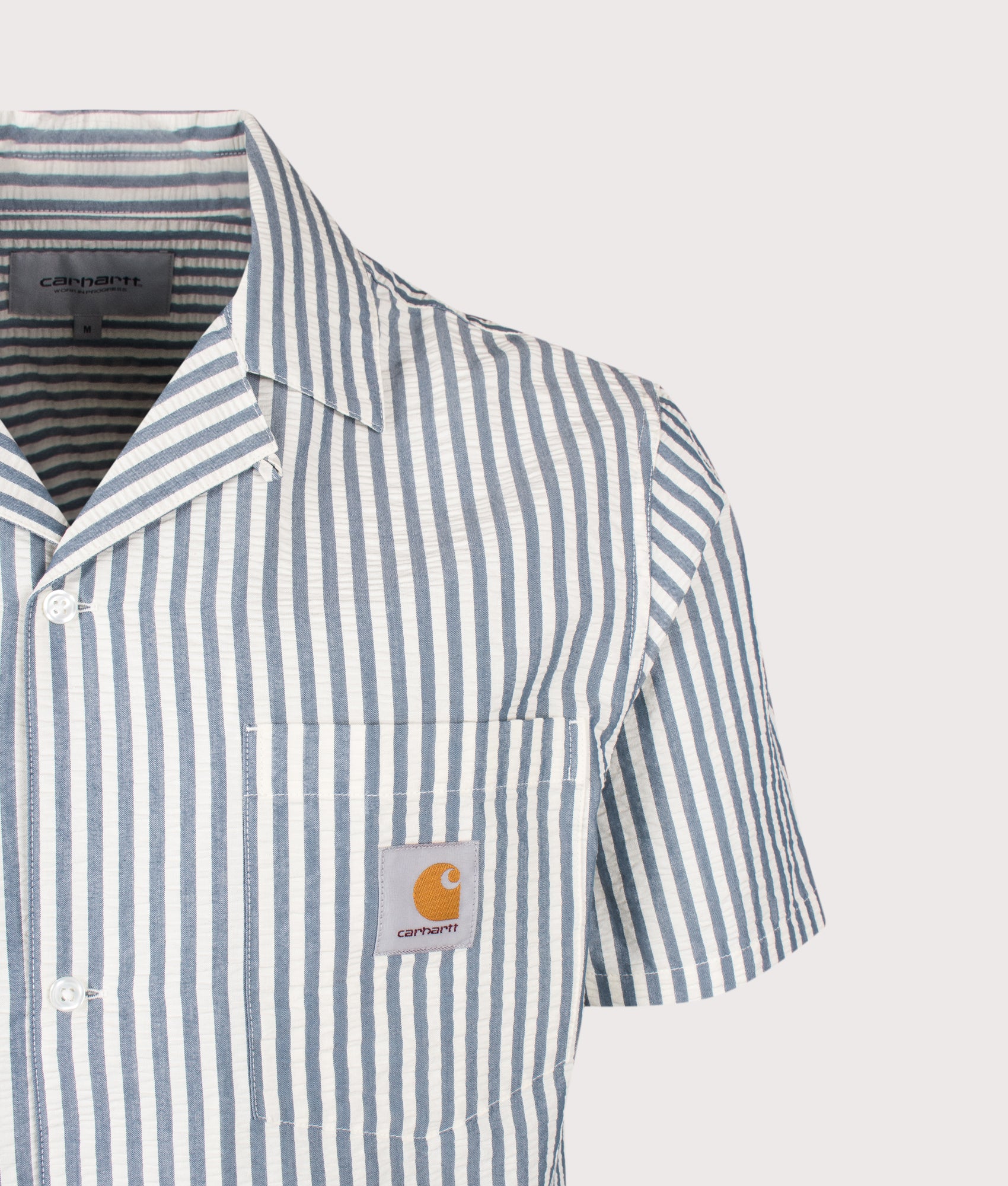 Relaxed Fit Short Sleeve Leavel Shirt in Leavel Stripe/Blue River/Wax by Carhartt WIP. Shot by EQVVS. Detail shot.