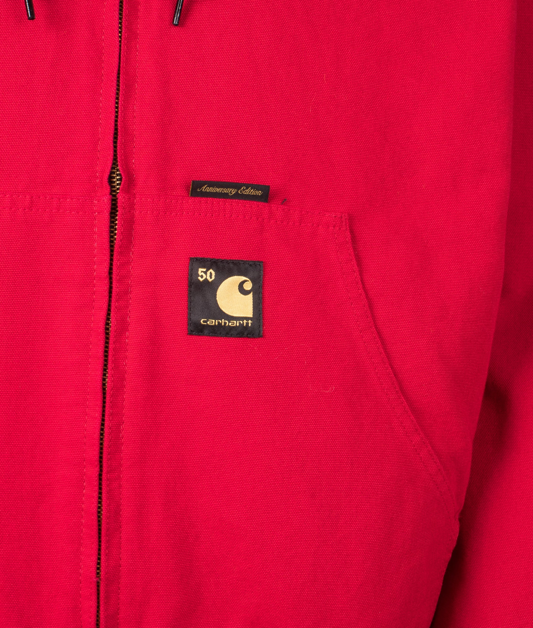 Carhartt WIP 50 Years Anniversary OG Active Canvas Jacket in Black/USA Red at EQVVS Menswear. Side B detail shot.