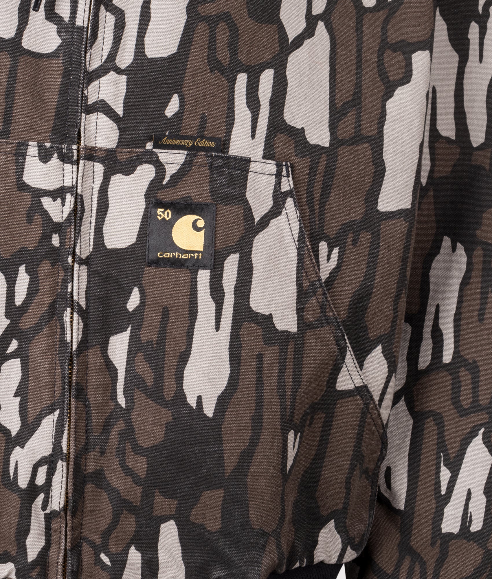 Carhartt WIP 50 Years Anniversary OG Active Canvas Jacket in Hamilton Brown/Camo Trebark at EQVVS Menswear. Side B detail shot.