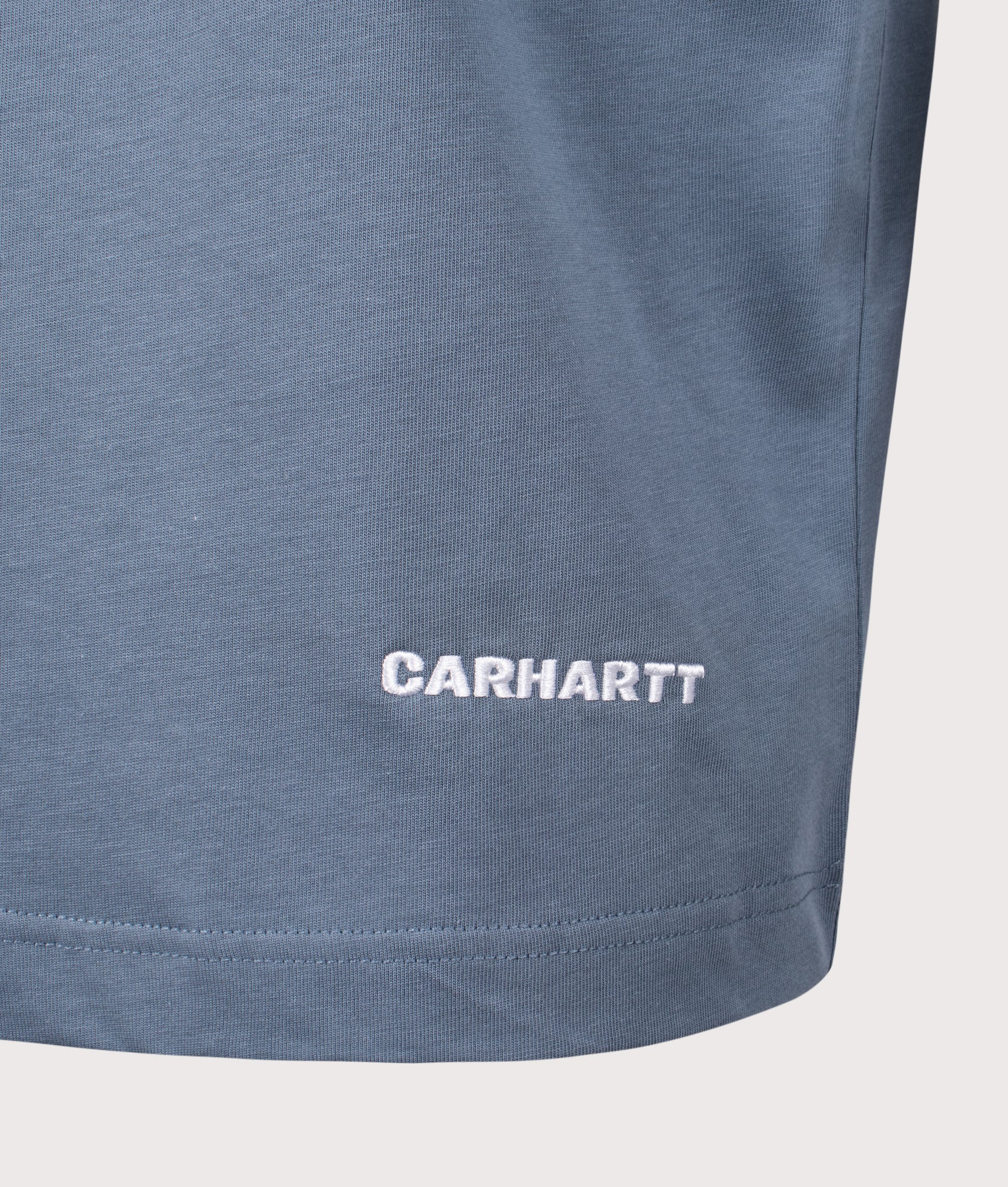 Carhartt WIP Relaxed Fit Link Script T-Shirt in Velvet Blue and White at EQVVS Menswear. Detail shot.