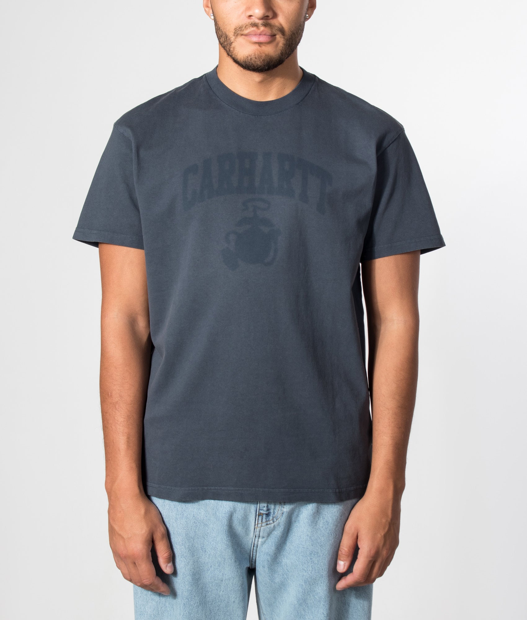 Carhartt WIP Loose Fit Faded Pond Corps T-Shirt in Deep Night at EQVVS Menswear. Model front shot.