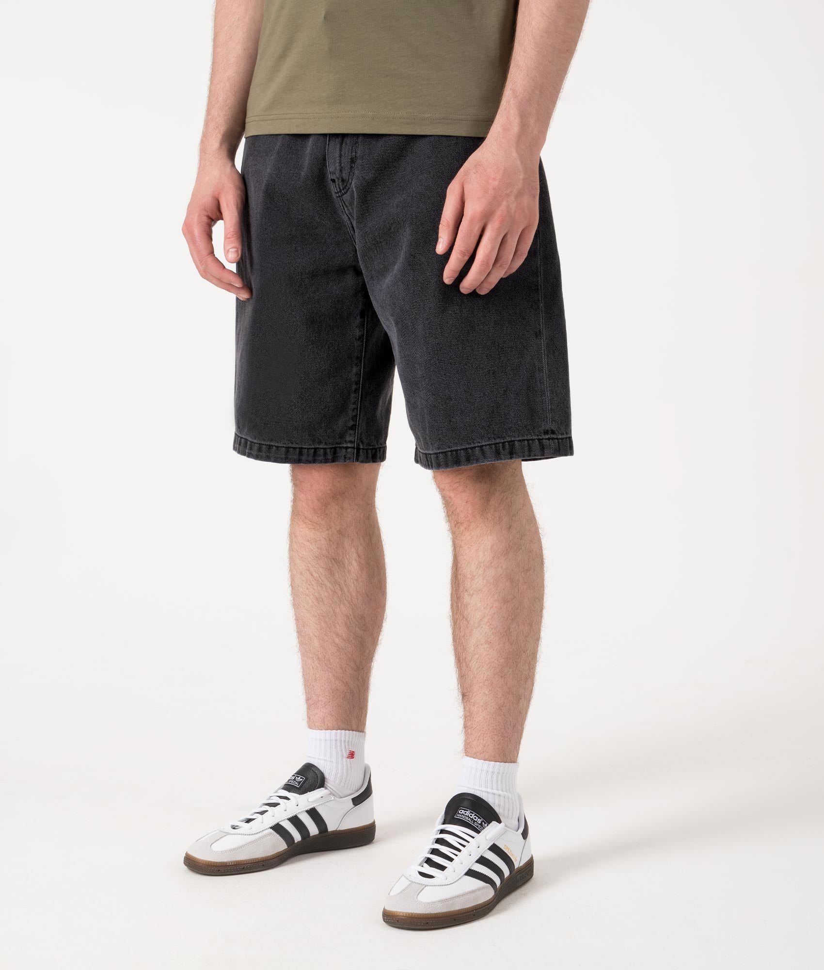 Relaxed Fit Landon Denim Shorts in Black by Carhartt WIP. Shot by EQVVS. Front angled shot.