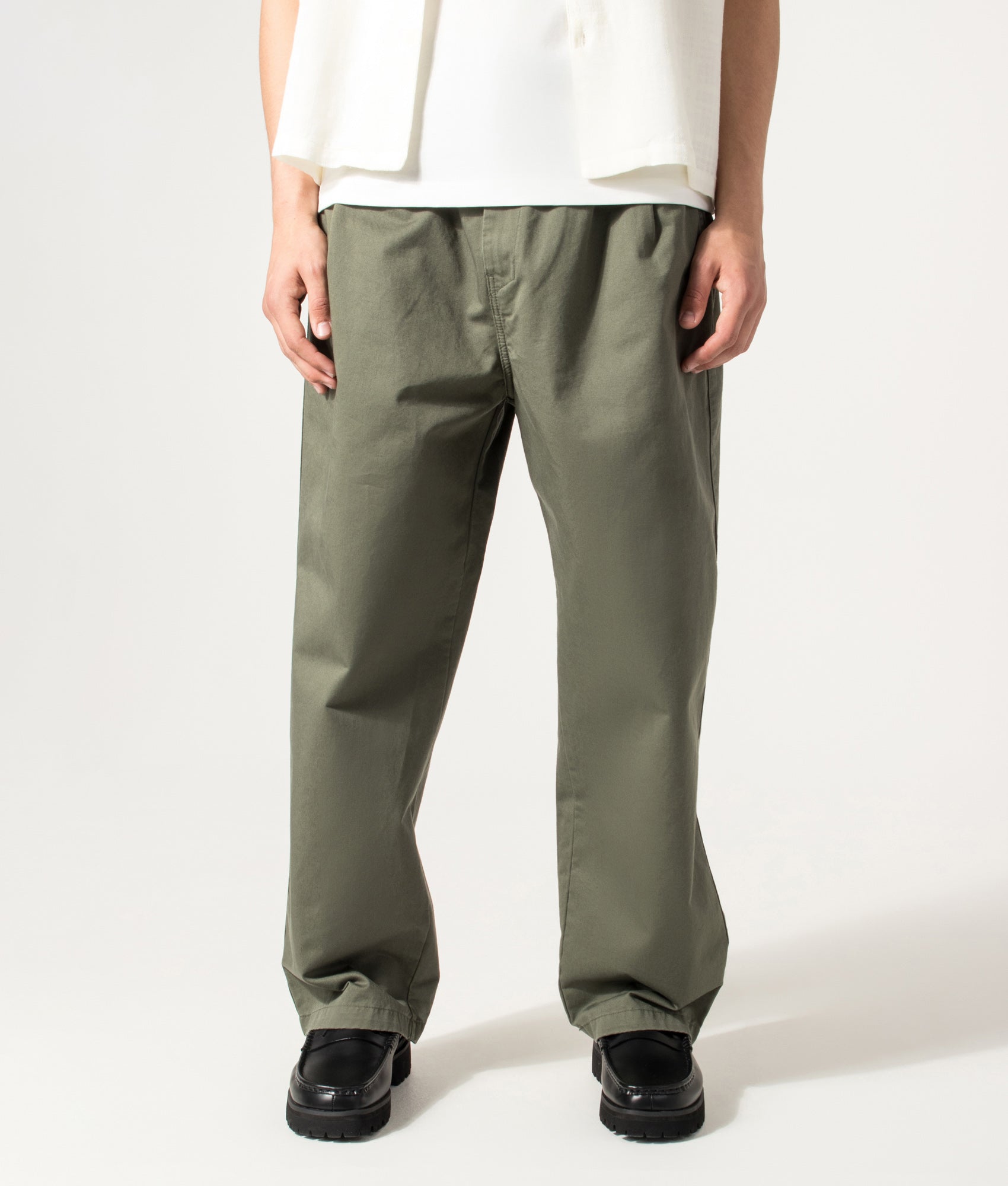 Carhartt WIP Marv Pants in Leaf at EQVVS Menswear. Model front shot.