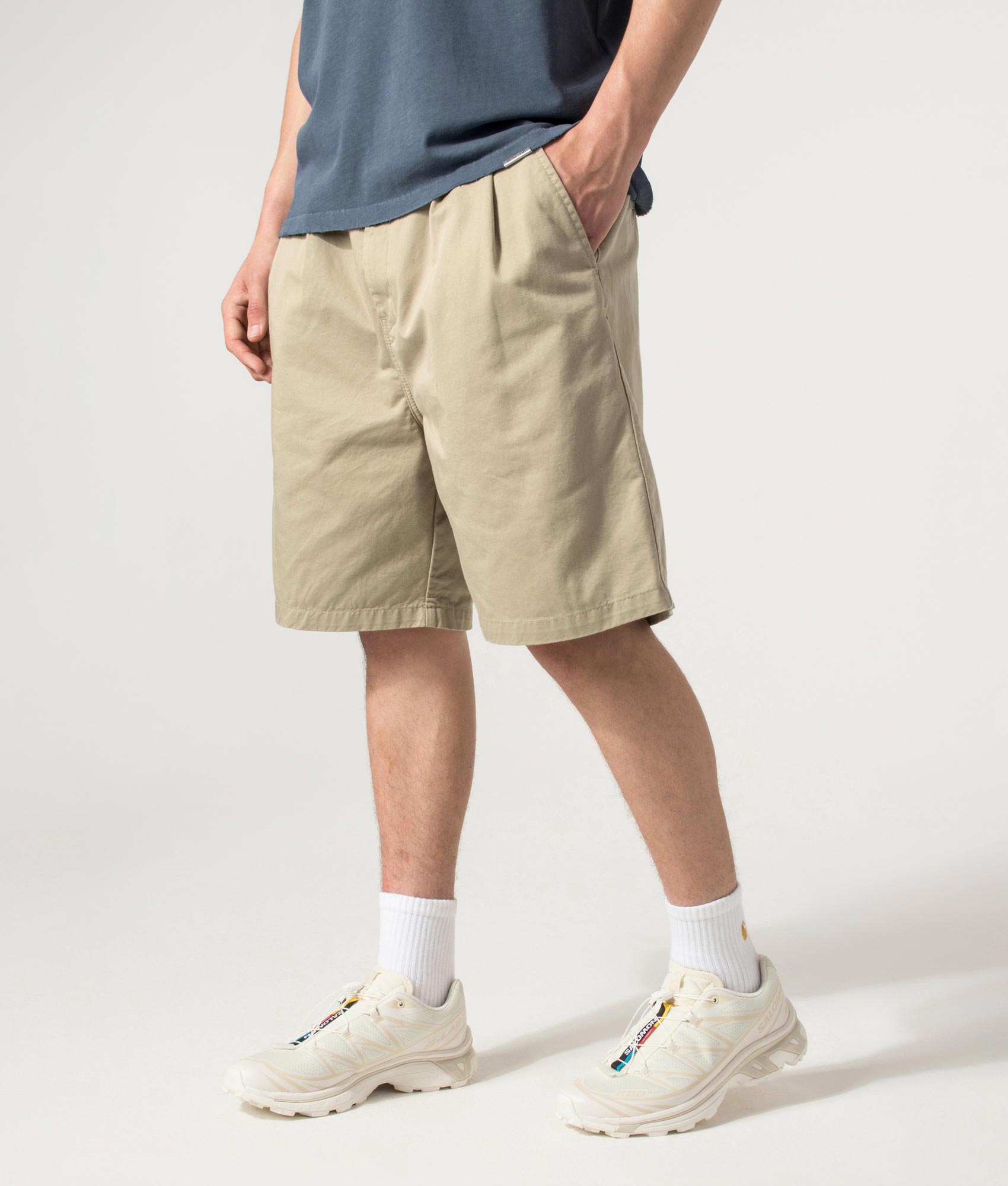 Carhartt WIP Marv Shorts in Stone Washed Iroko at EQVVS Menswear. Angled model front shot.