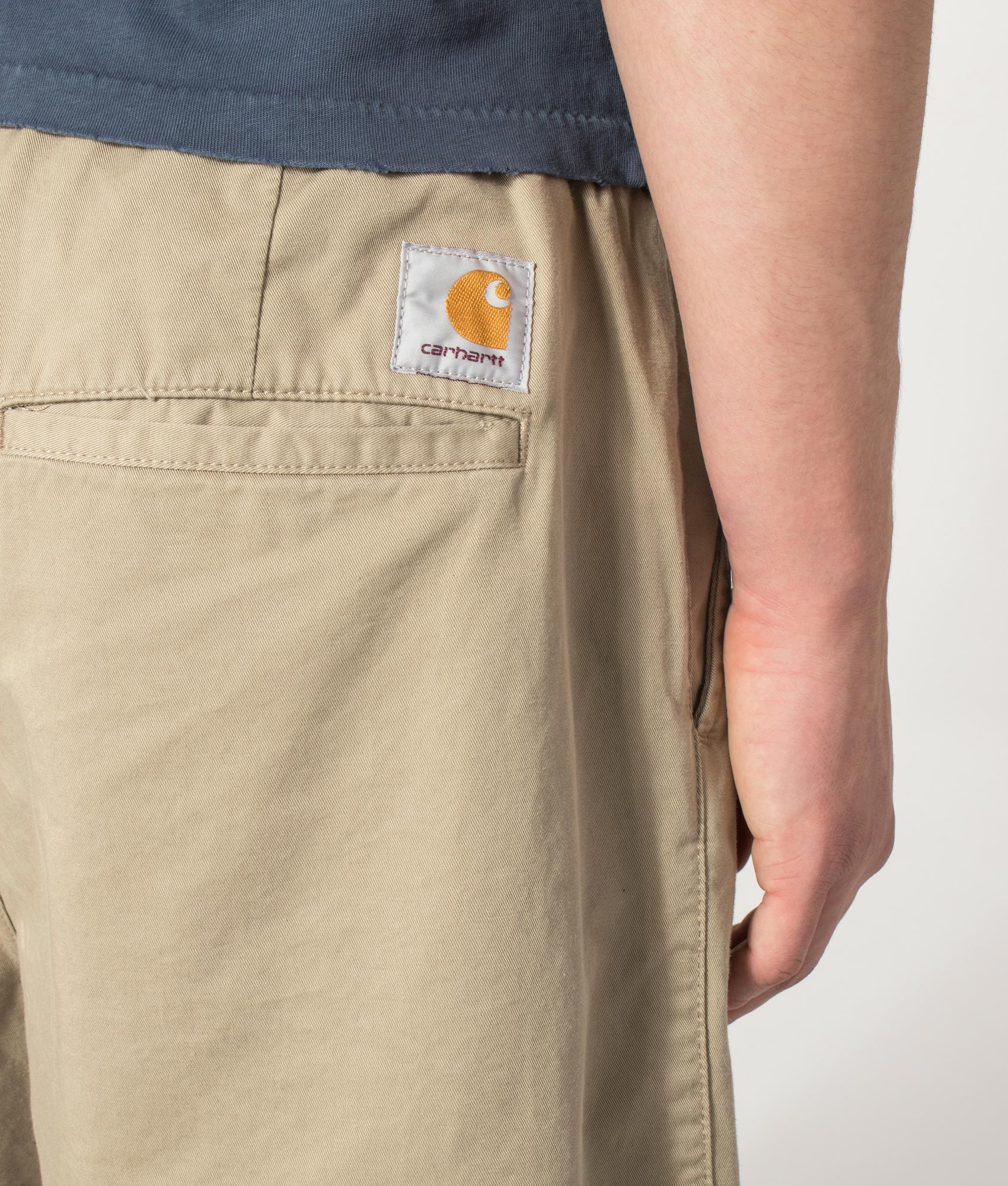 Carhartt WIP Marv Shorts in Stone Washed Iroko at EQVVS Menswear. Detail shot.