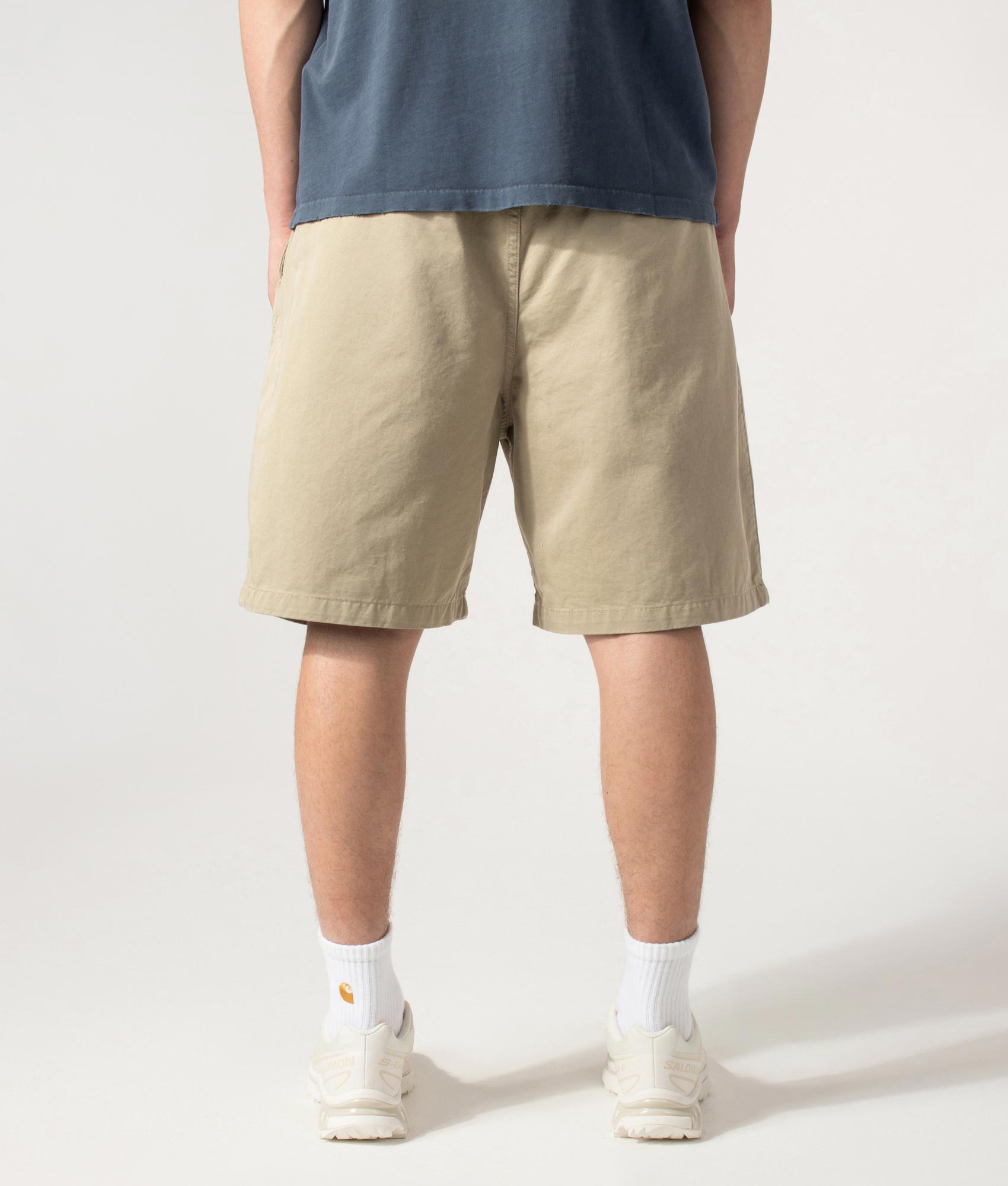 Carhartt WIP Marv Shorts in Stone Washed Iroko at EQVVS Menswear. Model back shot.