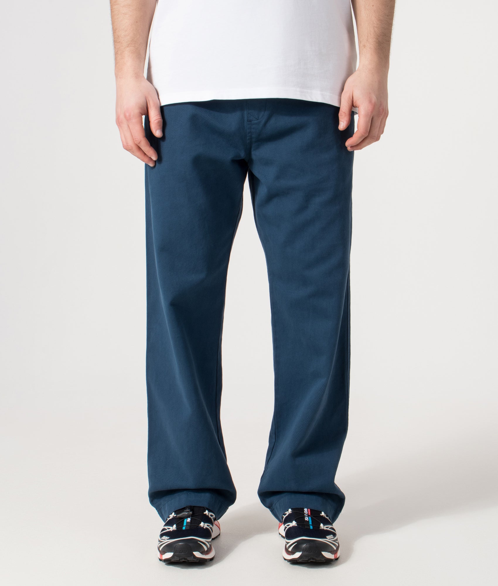 Carhartt WIP Relaxed Fit Floyde Pants  in Blue River at EQVVS Menswear. Model front shot.