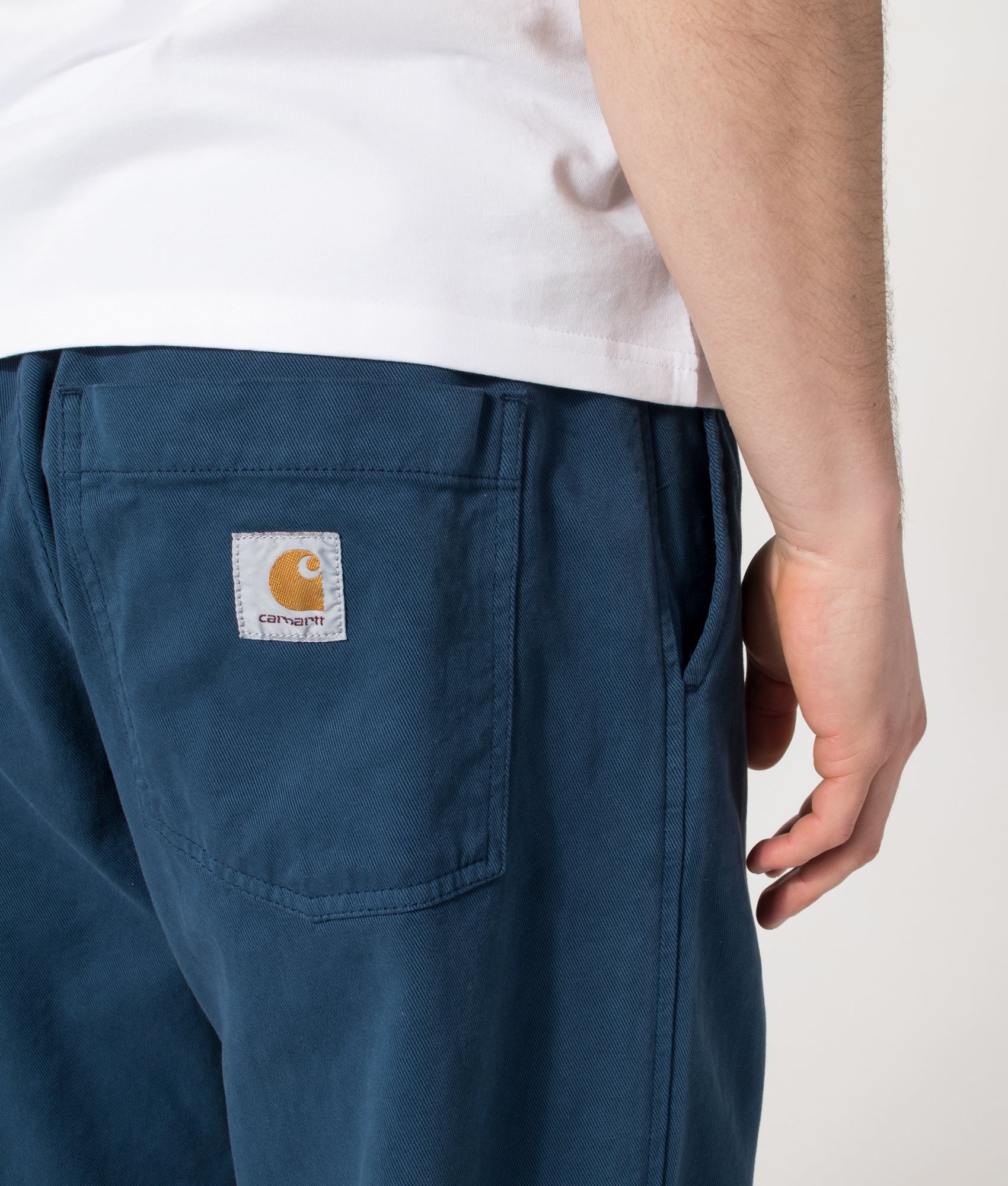 Carhartt WIP Relaxed Fit Floyde Pants  in Blue River at EQVVS Menswear. Back detail shot.