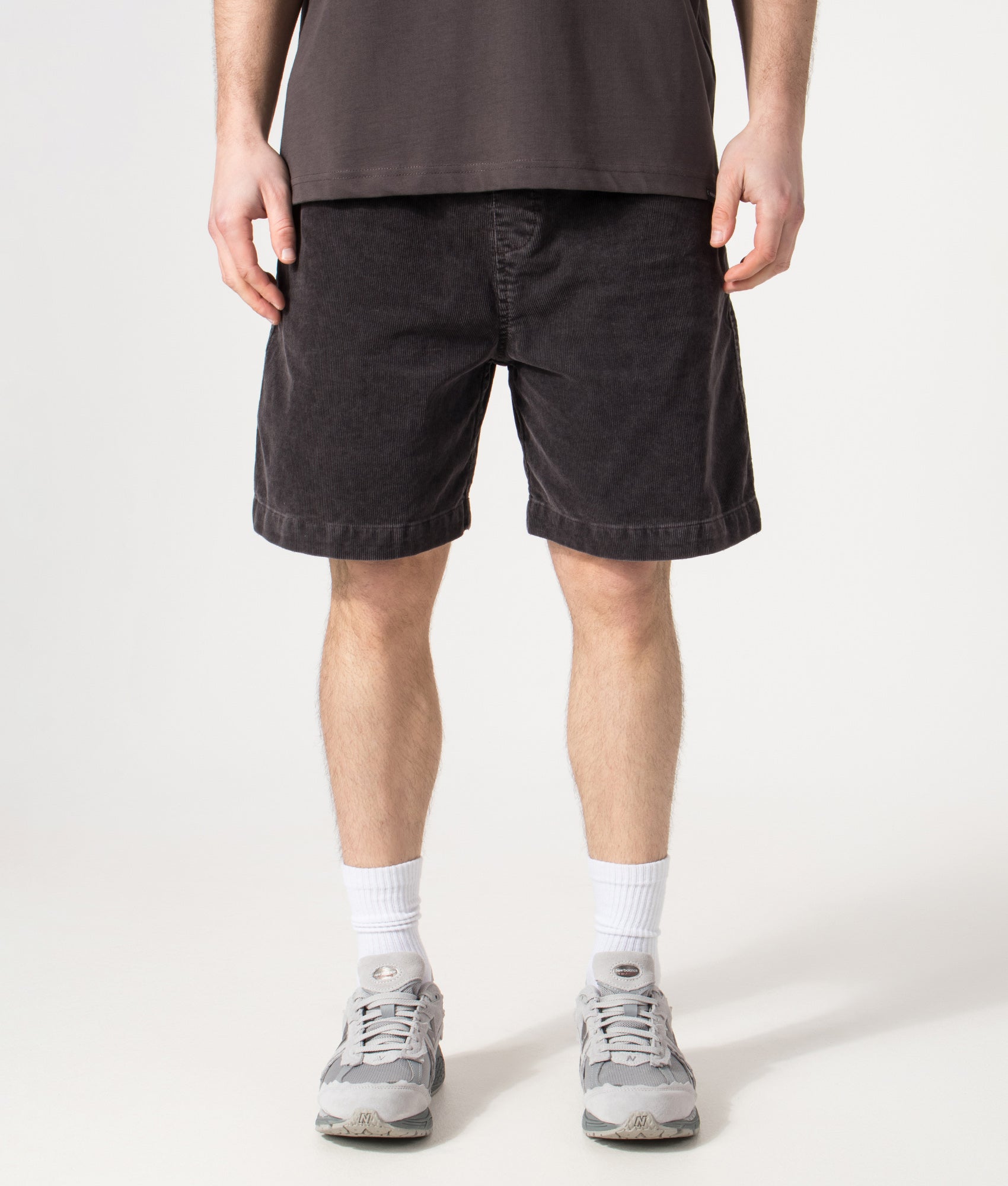 Carhartt WIP Relaxed Fit Reynold Shorts  in Shale at EQVVS Menswear. Model front shot.