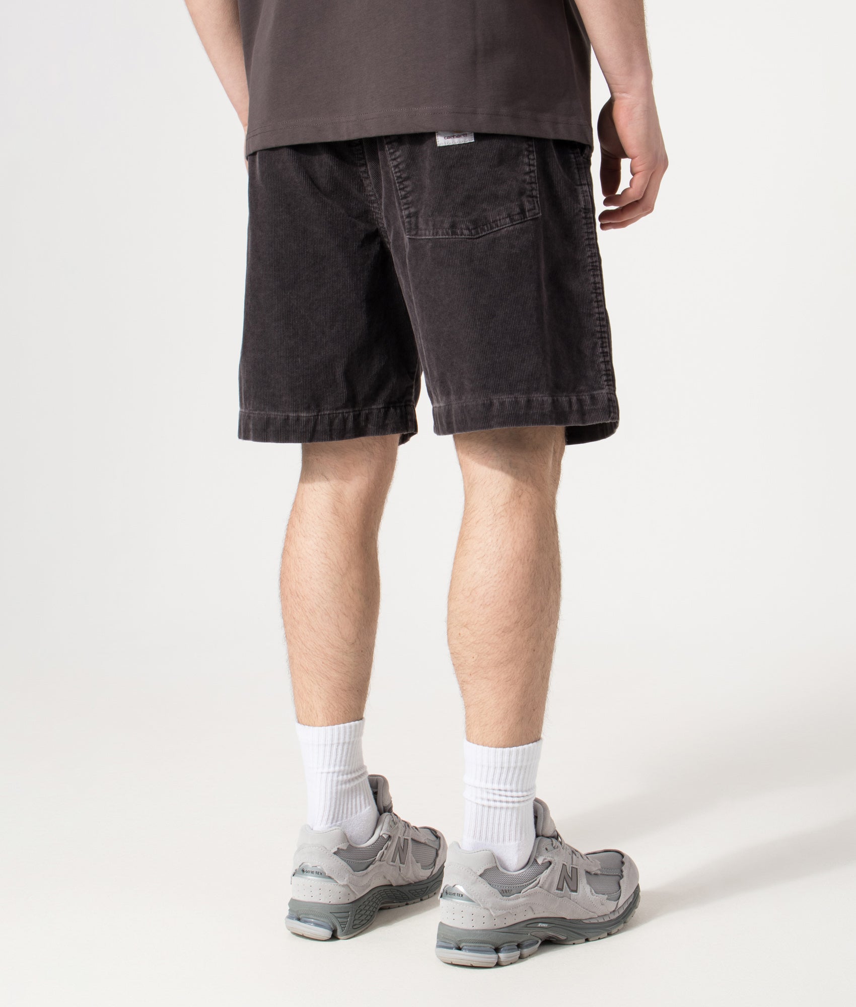 Carhartt WIP Relaxed Fit Reynold Shorts  in Shale at EQVVS Menswear. Model back shot.