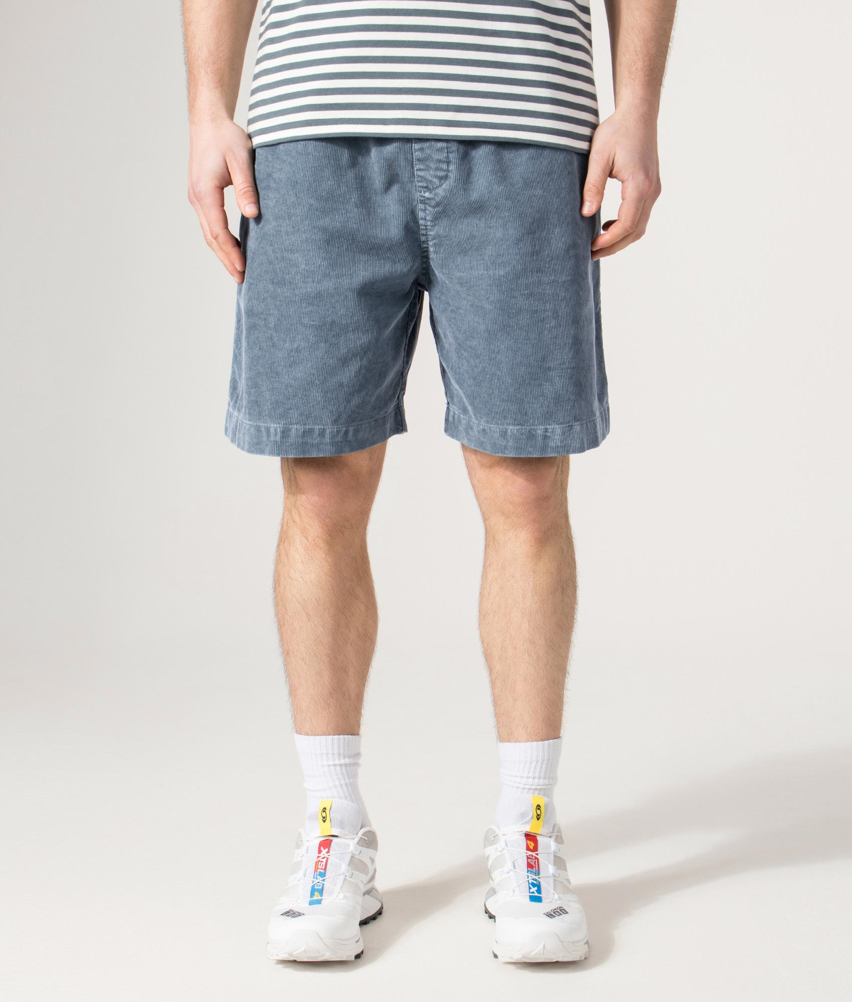 Carhartt WIP Relaxed Fit Reynold Shorts  in Cozy Blue at EQVVS Menswear.  Model front shot.